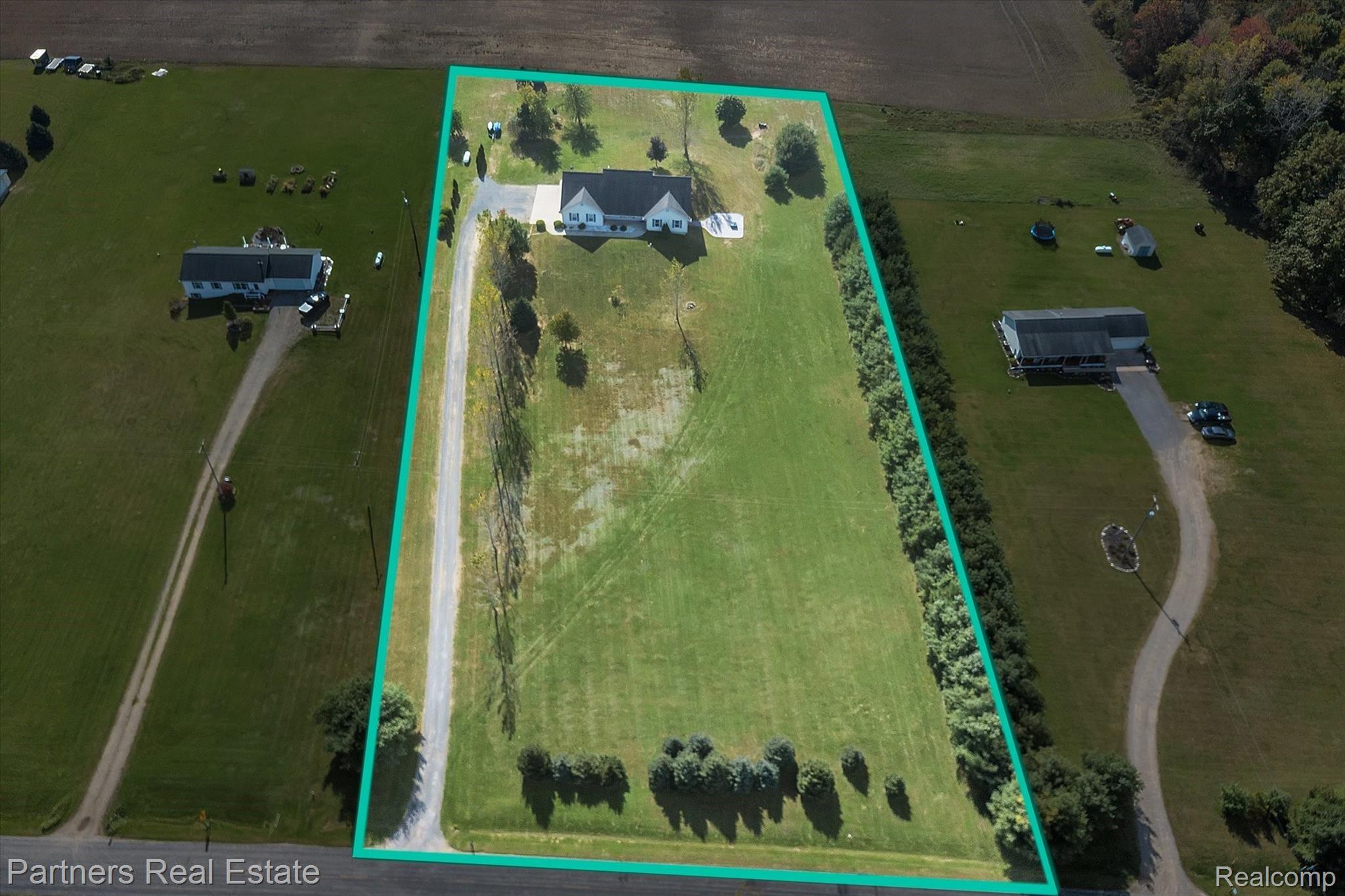 A beautiful country setting. 3.16 acres of peace and privacy. Both sides of the front yard are tree lined and the back of the property ends at the soy bean field. Deer visit the property every night. 