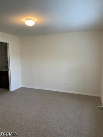 an empty room with a bench
