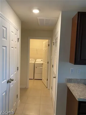 a bathroom with a granite countertop sink a mirror and a shower