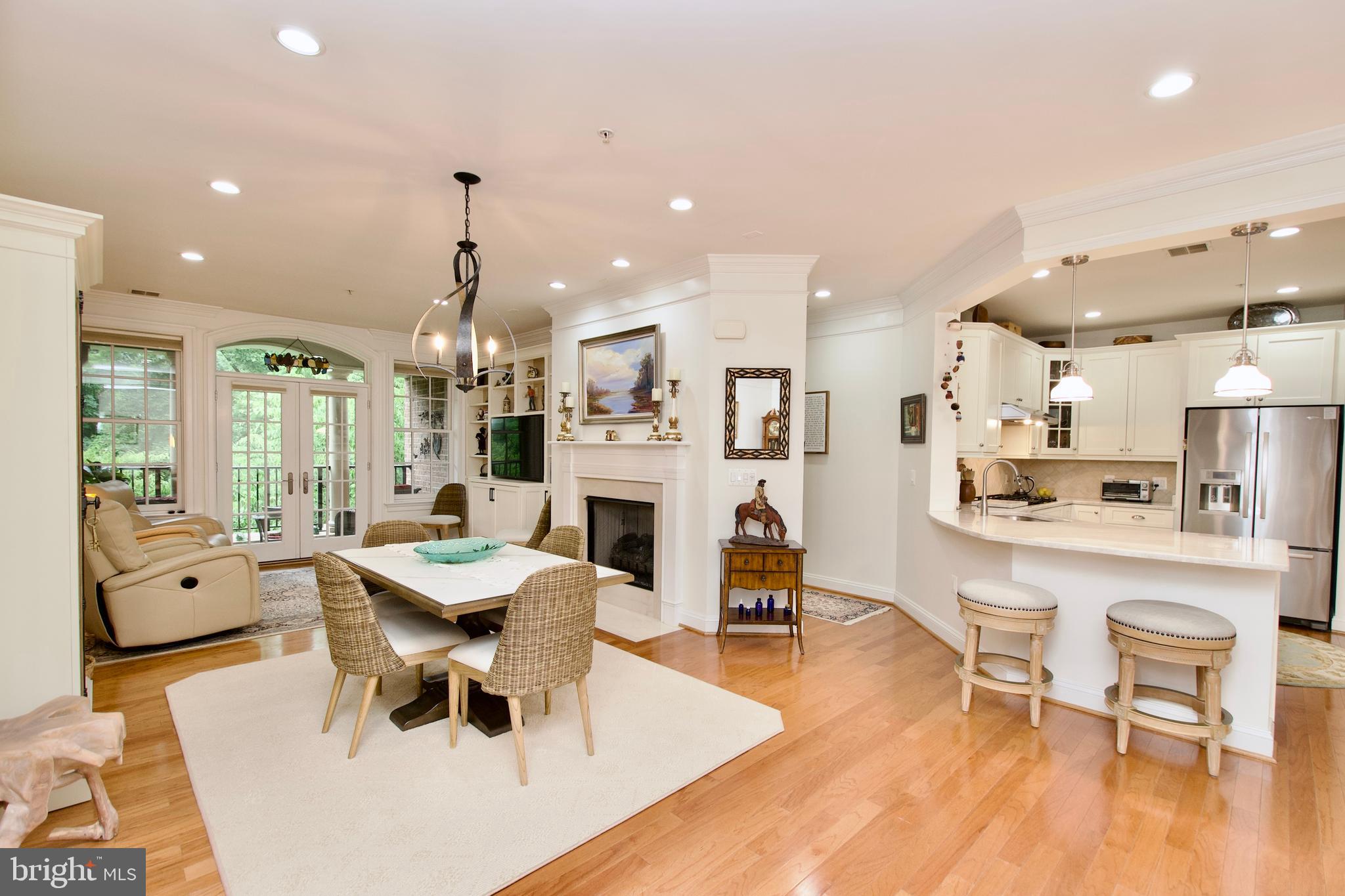 1781 Chain Bridge Road, Unit 302 McLean, VA 22102 - Photo 38 of 39 a large kitchen with a table and chairs