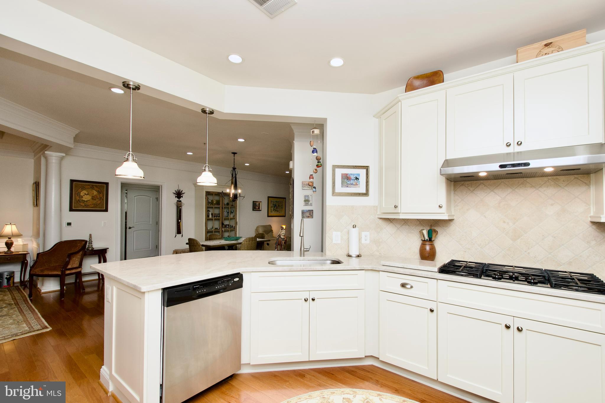 1781 Chain Bridge Road, Unit 302 McLean, VA 22102 - Photo 10 of 39 a kitchen with a sink stove and cabinets
