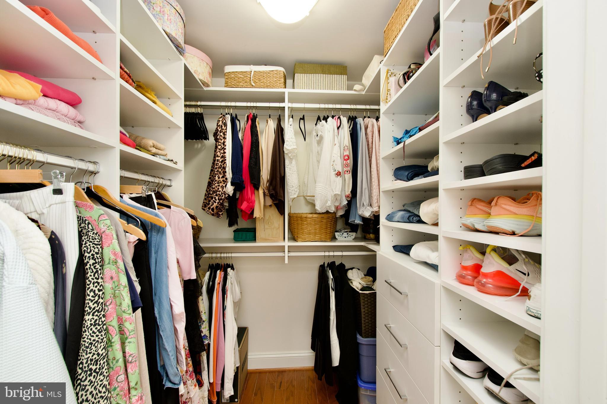 1781 Chain Bridge Road, Unit 302 McLean, VA 22102 - Photo 20 of 39 a view of walk in closet with clothes and shoes