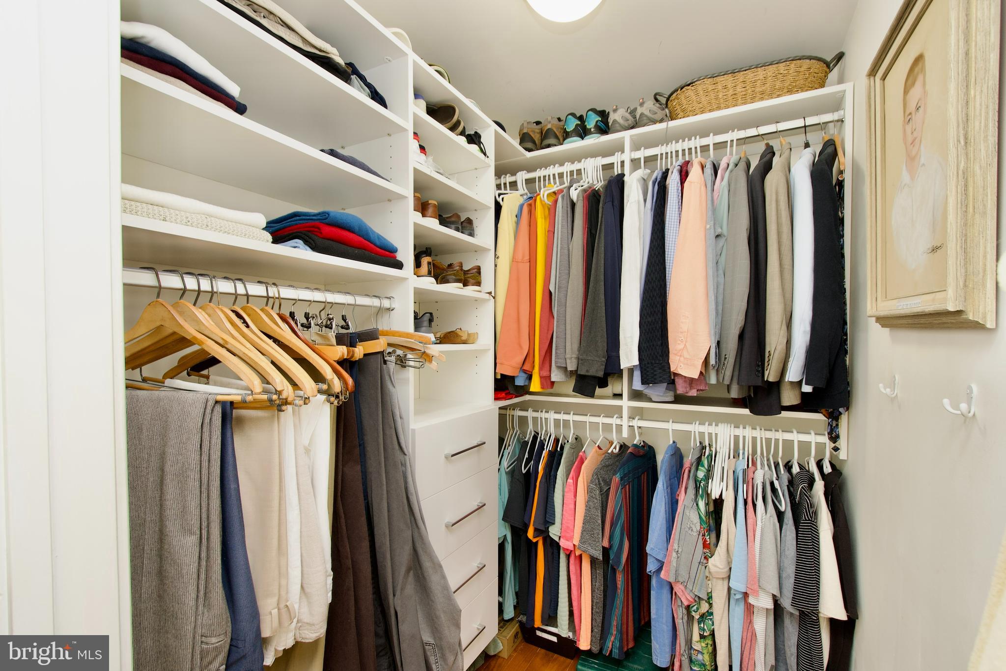 1781 Chain Bridge Road, Unit 302 McLean, VA 22102 - Photo 21 of 39 a view of walk in closet with clothes and shoes