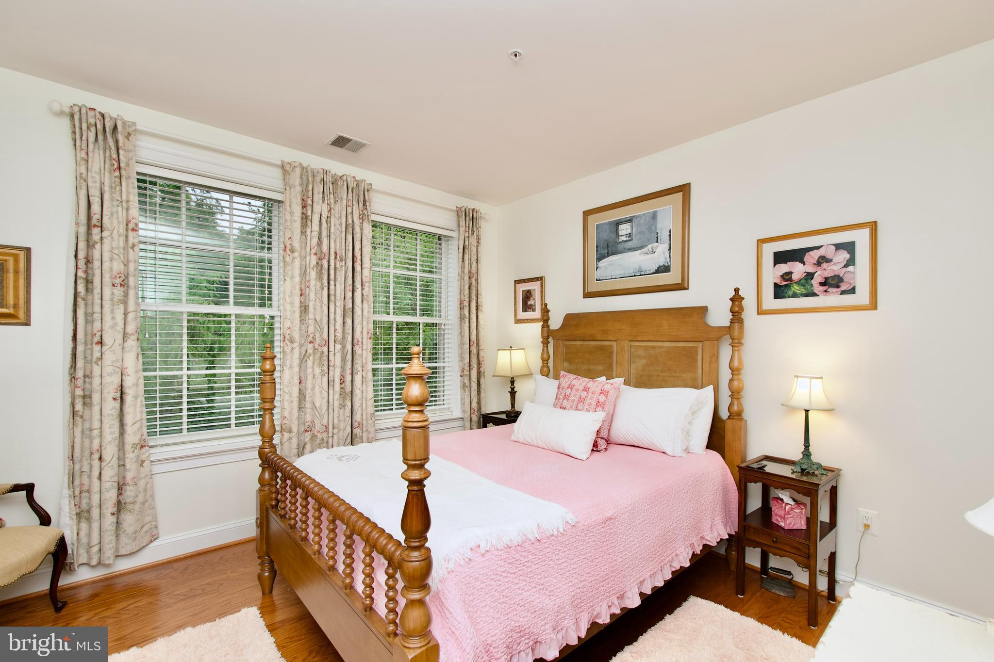 1781 Chain Bridge Road, Unit 302 McLean, VA 22102 - Photo 22 of 39 a bedroom with a bed and a window