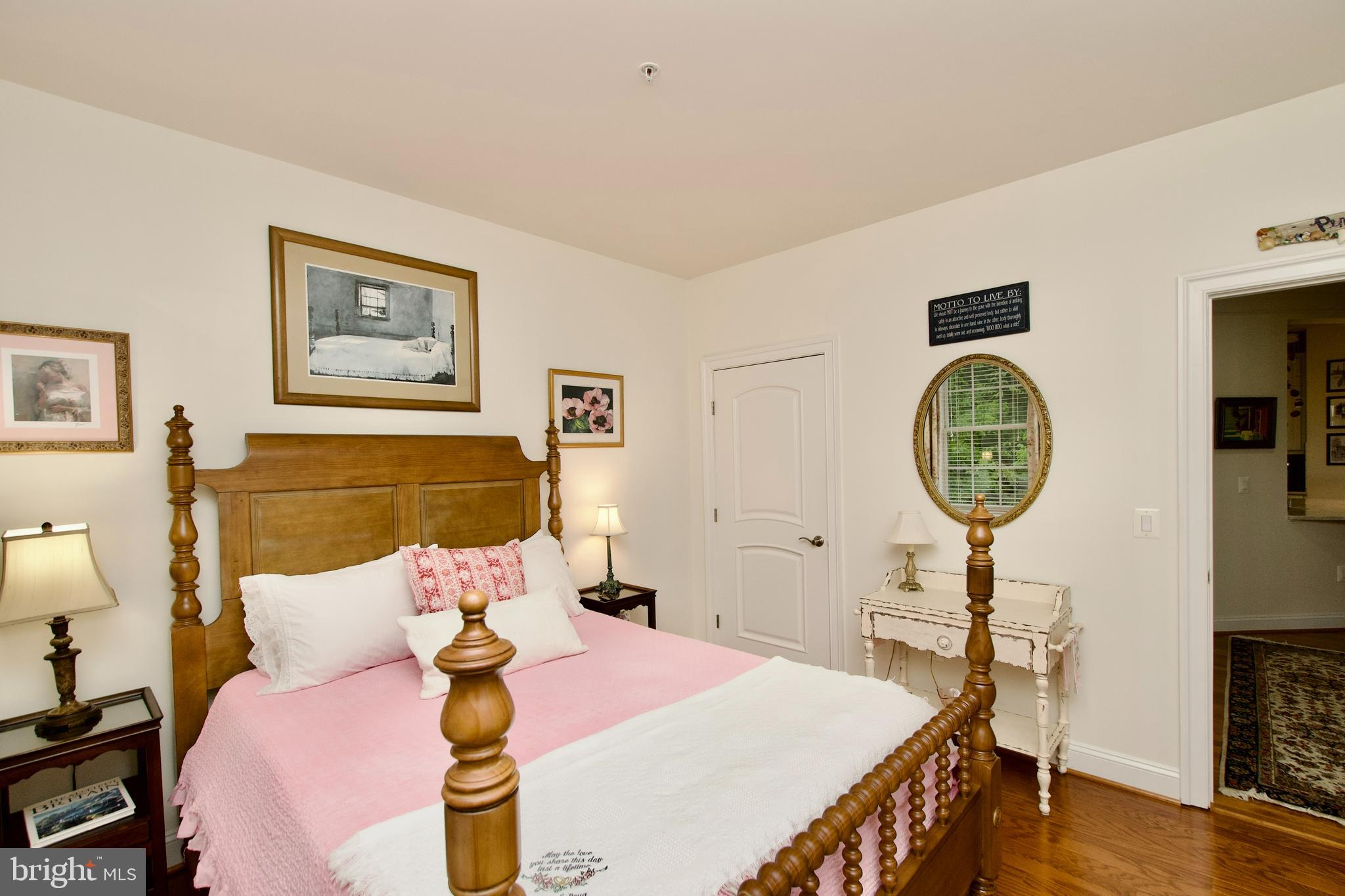 1781 Chain Bridge Road, Unit 302 McLean, VA 22102 - Photo 23 of 39 a bed room with a bed a mirror and a table