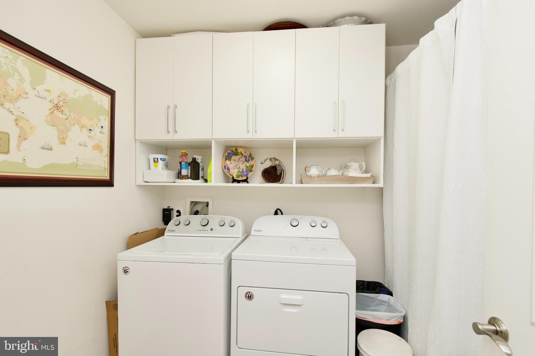 1781 Chain Bridge Road, Unit 302 McLean, VA 22102 - Photo 25 of 39 a utility room with dryer and washer