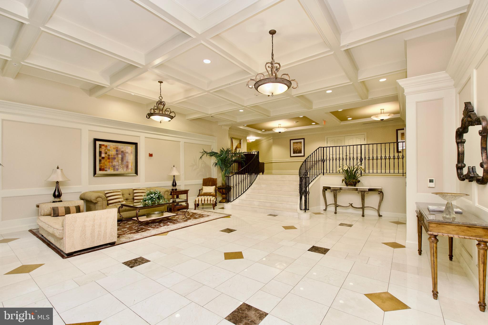 1781 Chain Bridge Road, Unit 302 McLean, VA 22102 - Photo 26 of 39 a living room with furniture and a chandelier