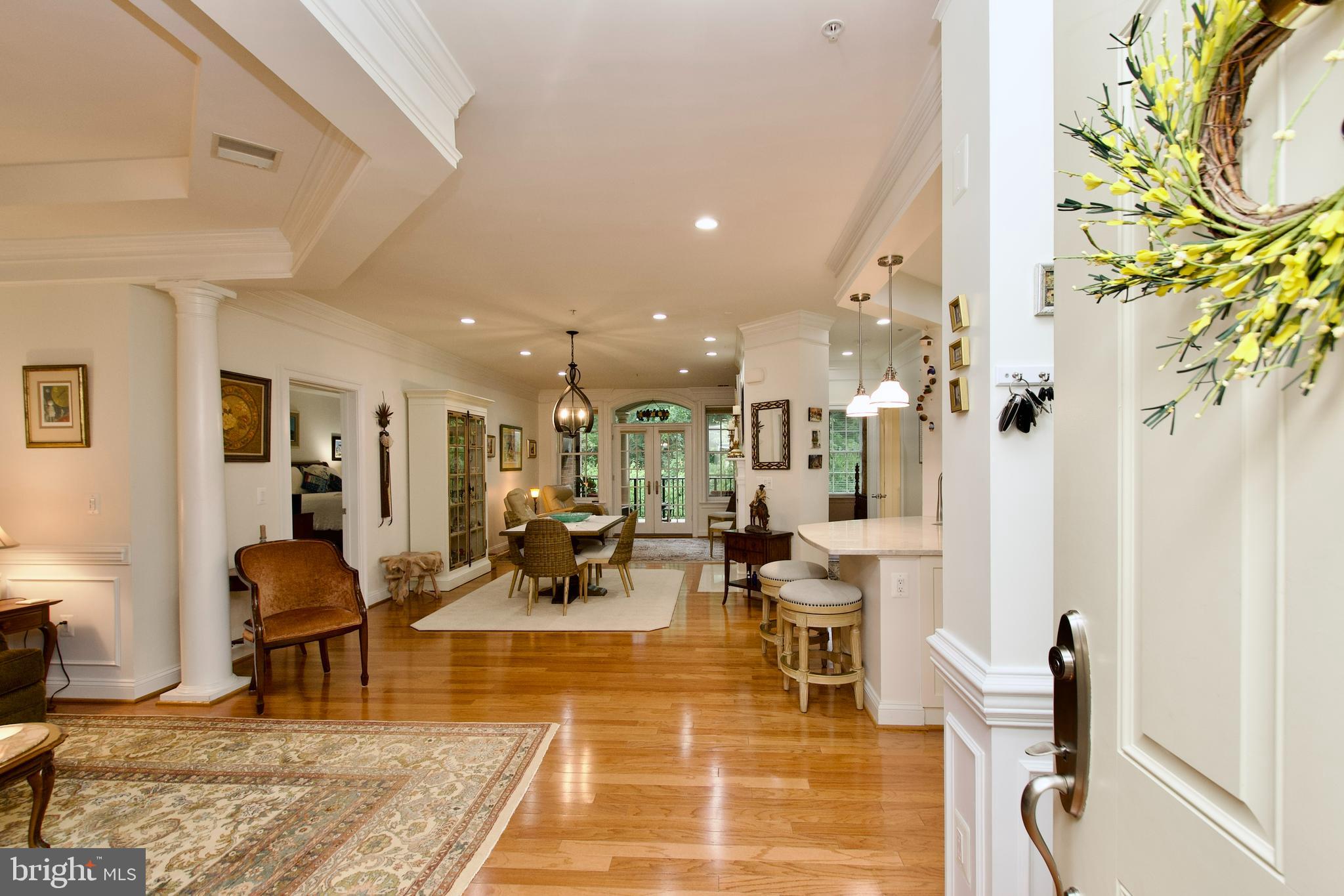 1781 Chain Bridge Road, Unit 302 McLean, VA 22102 - Photo 2 of 39 a living room with lots of furniture and a rug