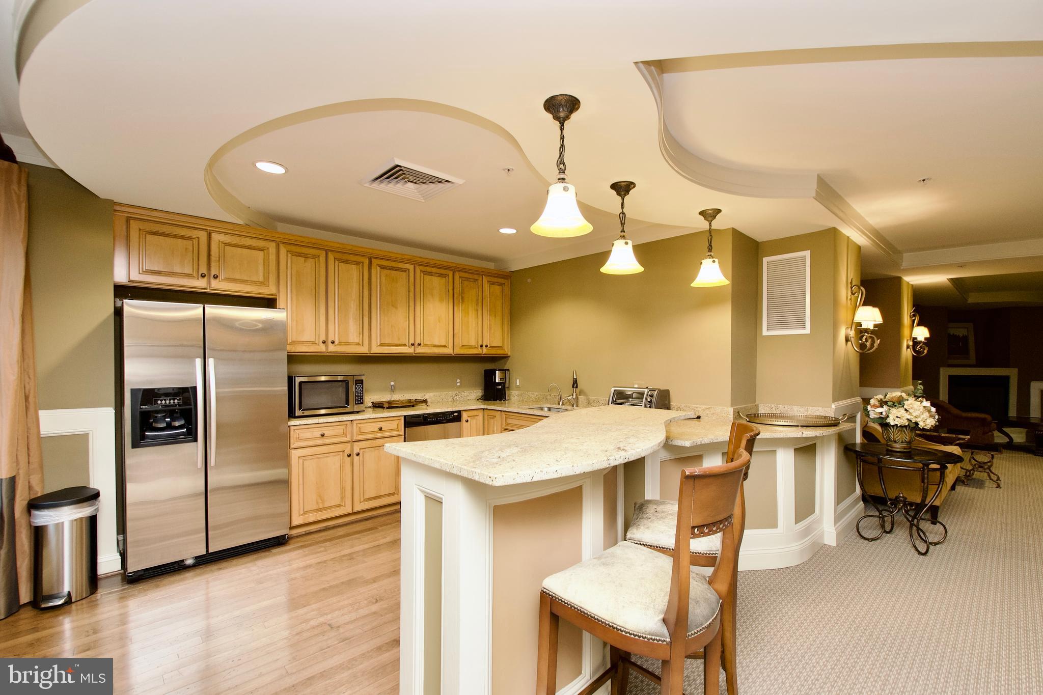 1781 Chain Bridge Road, Unit 302 McLean, VA 22102 - Photo 30 of 39 a kitchen with a sink cabinets and stainless steel appliances