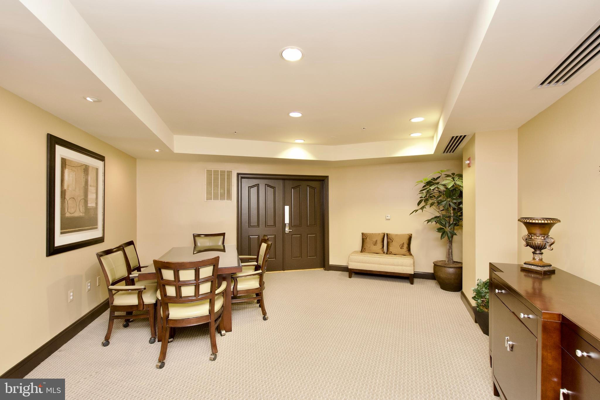 1781 Chain Bridge Road, Unit 302 McLean, VA 22102 - Photo 34 of 39 a living room with furniture and a flat screen tv