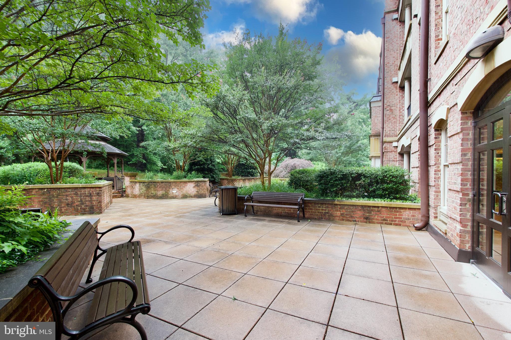 1781 Chain Bridge Road, Unit 302 McLean, VA 22102 - Photo 37 of 39 a backyard of a house with seating space