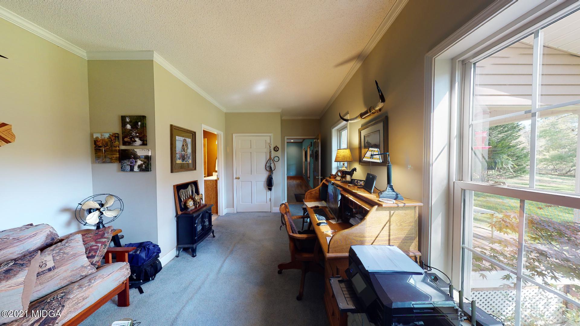 1534 Smith Road Forsyth, GA 31029 - Photo 12 of 25 a view of a livingroom with furniture and a window