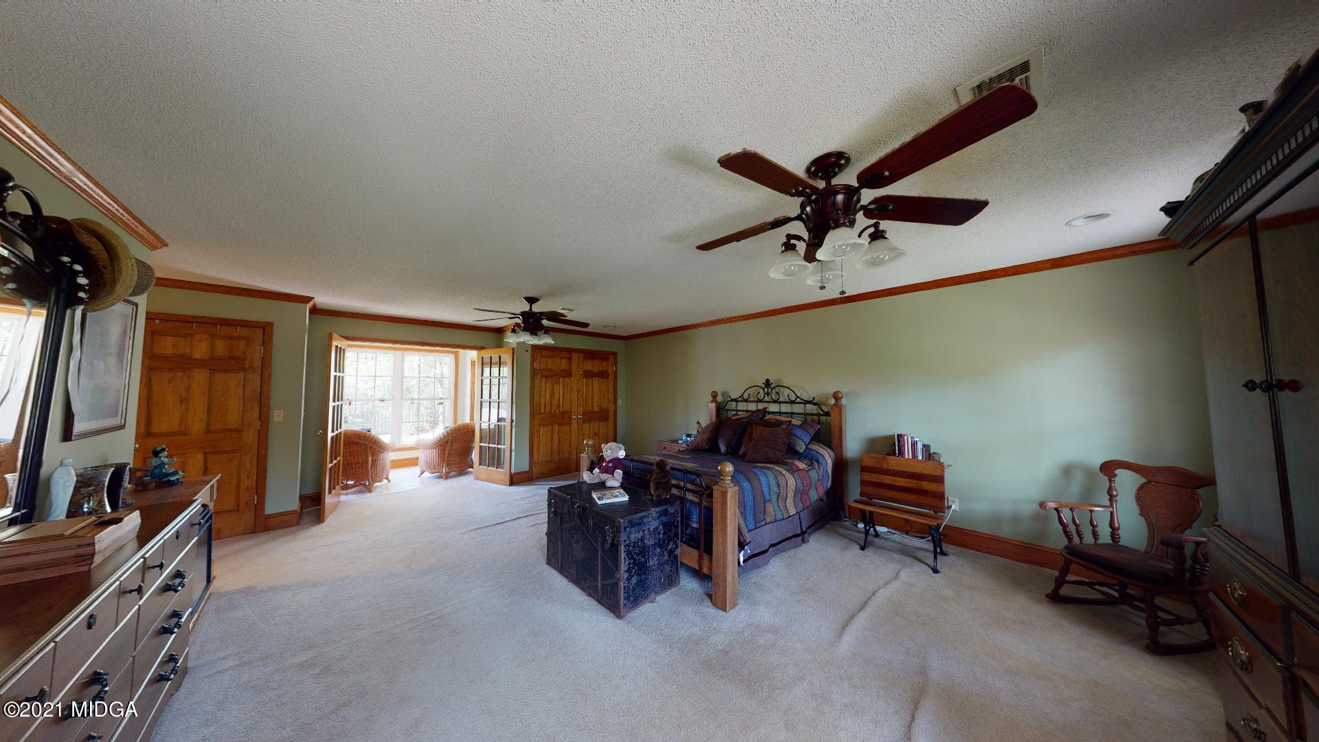 1534 Smith Road Forsyth, GA 31029 - Photo 18 of 25 a view of a livingroom with workspace and a window