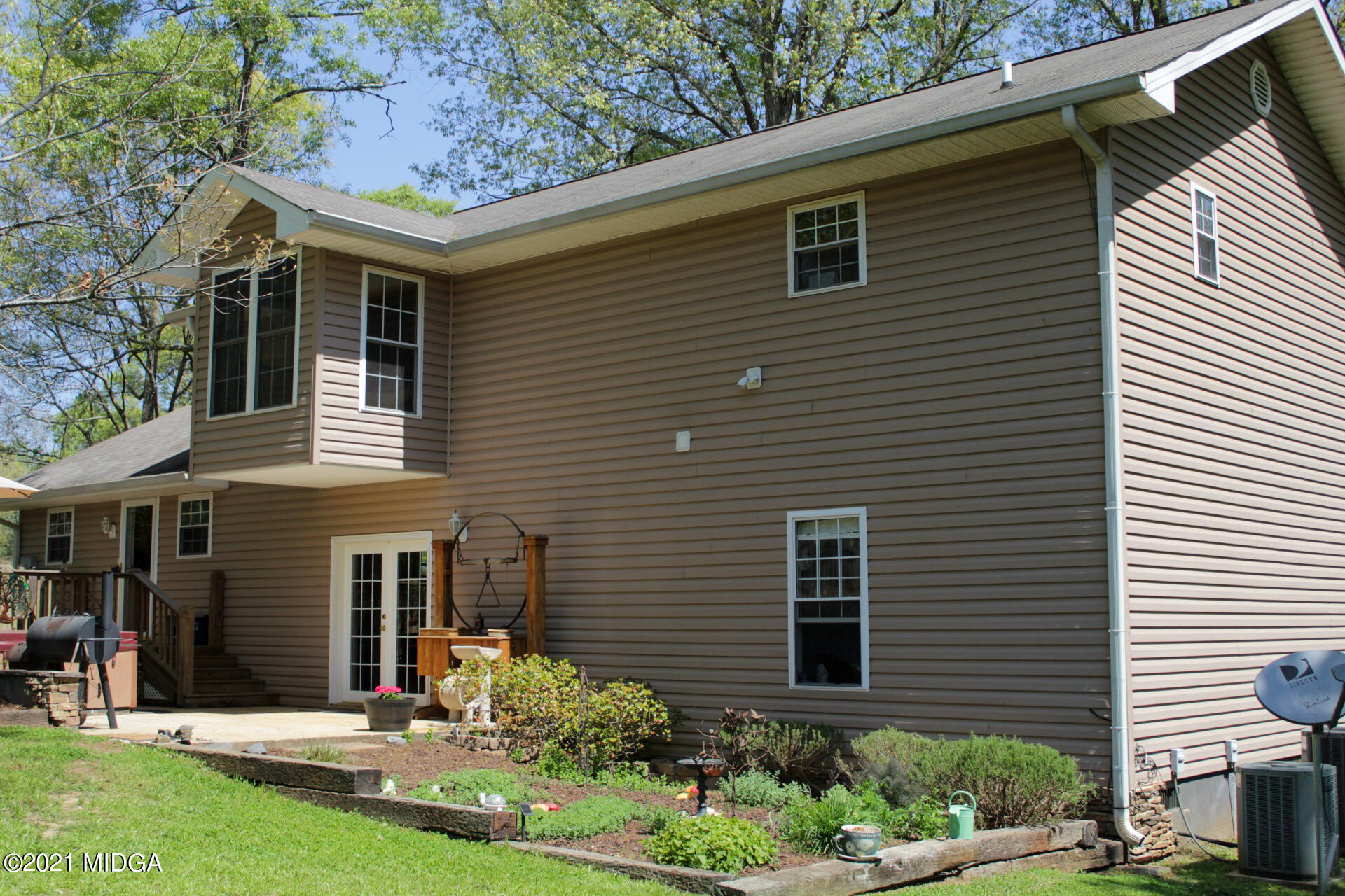 1534 Smith Road Forsyth, GA 31029 - Photo 22 of 25 a front view of a house with a yard and garage