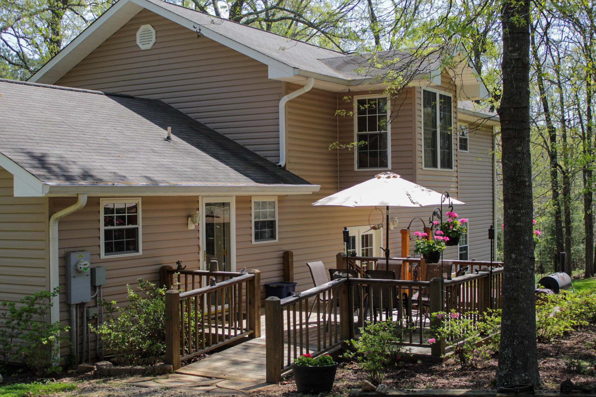 1534 Smith Road Forsyth, GA 31029 - Photo 23 of 25 a patio with a table and chairs under an umbrella