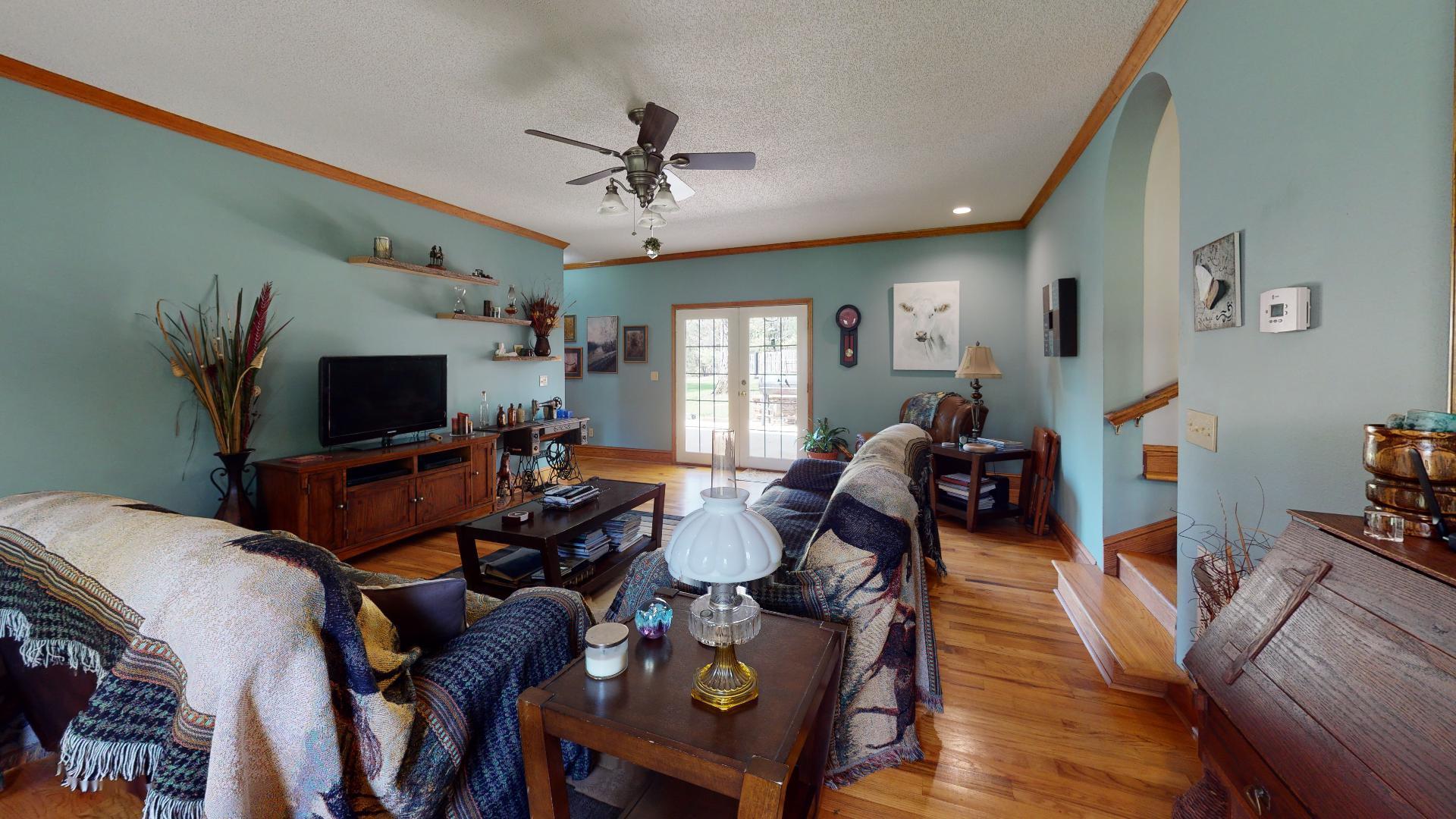 1534 Smith Road Forsyth, GA 31029 - Photo 4 of 25 a living room with furniture a flat screen tv and a window