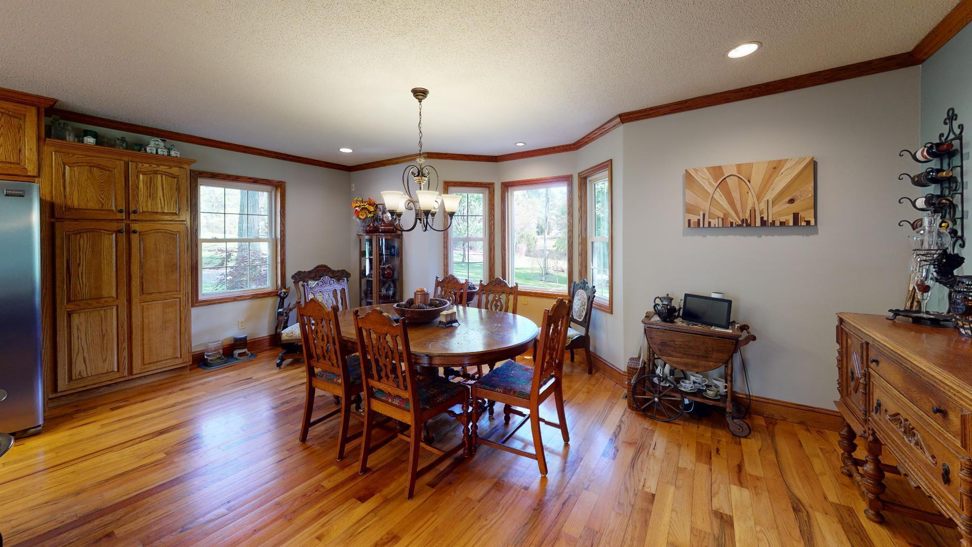 1534 Smith Road Forsyth, GA 31029 - Photo 9 of 25 a view of a dining room with furniture window and wooden floor