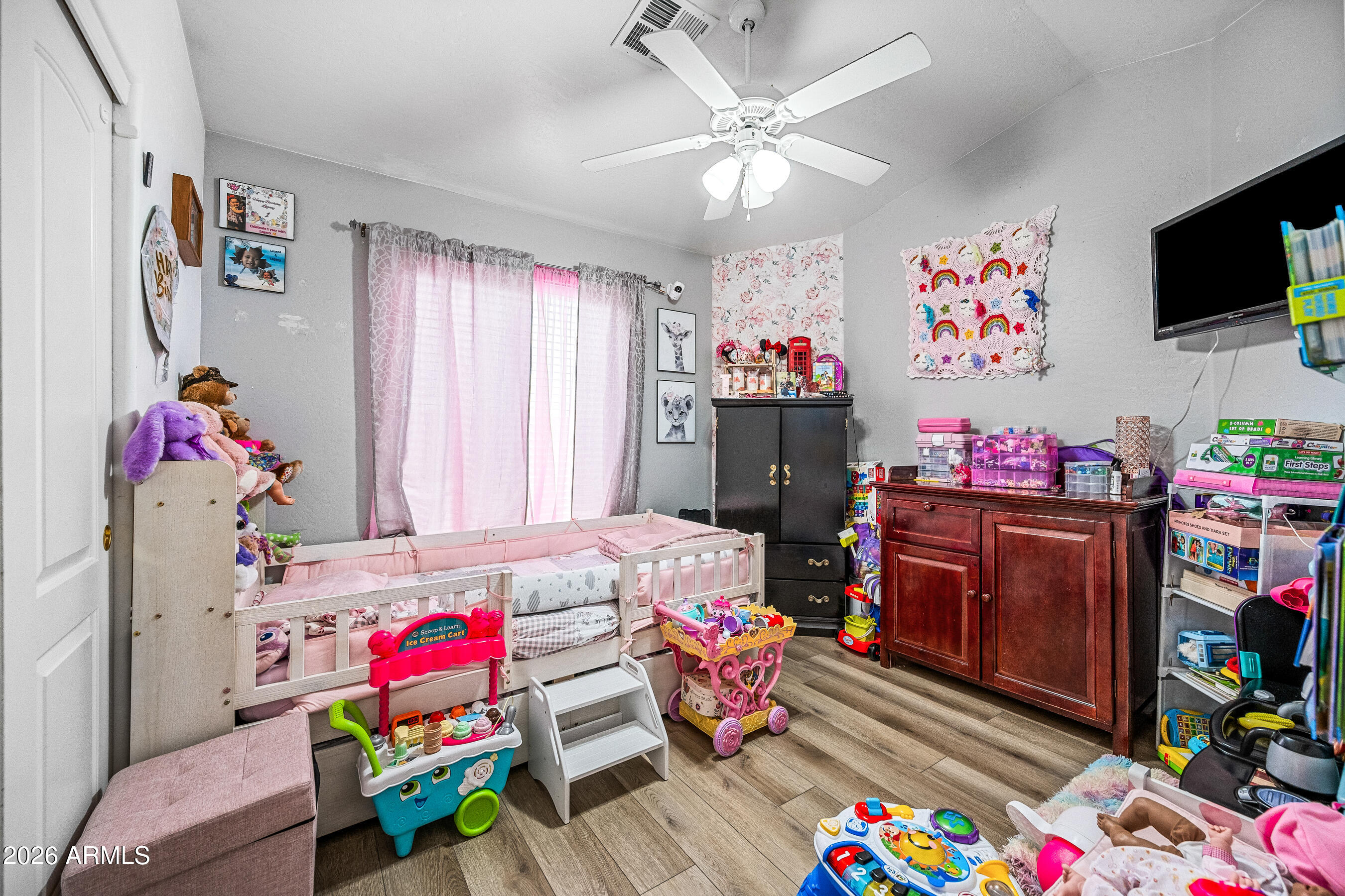 1260 South Lindsay Road, Unit 38 Mesa, AZ 85204 - Photo 14 of 23 a bedroom with furniture and a flat screen tv