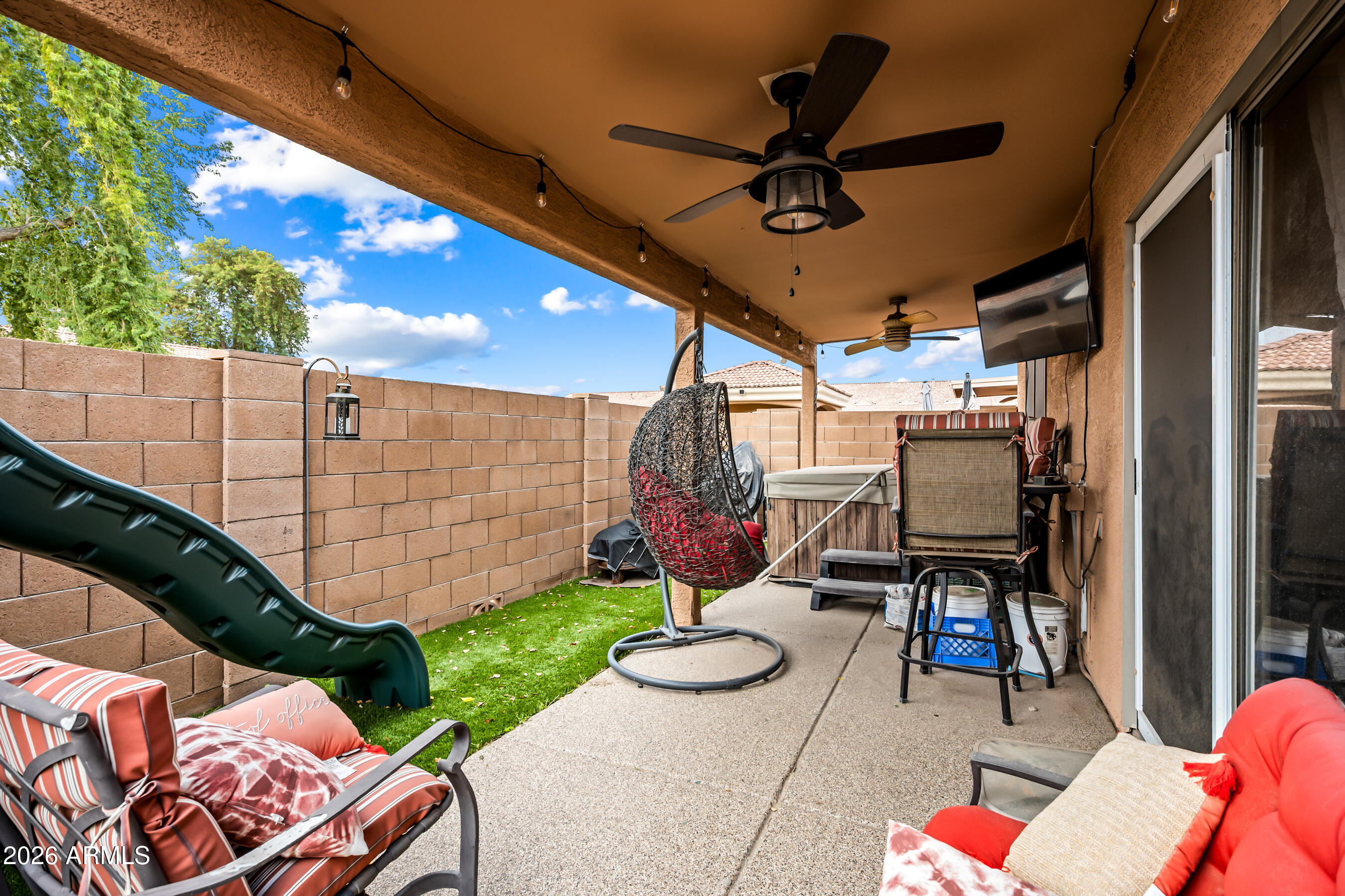 1260 South Lindsay Road, Unit 38 Mesa, AZ 85204 - Photo 20 of 23 a view of a chairs and table in backyard