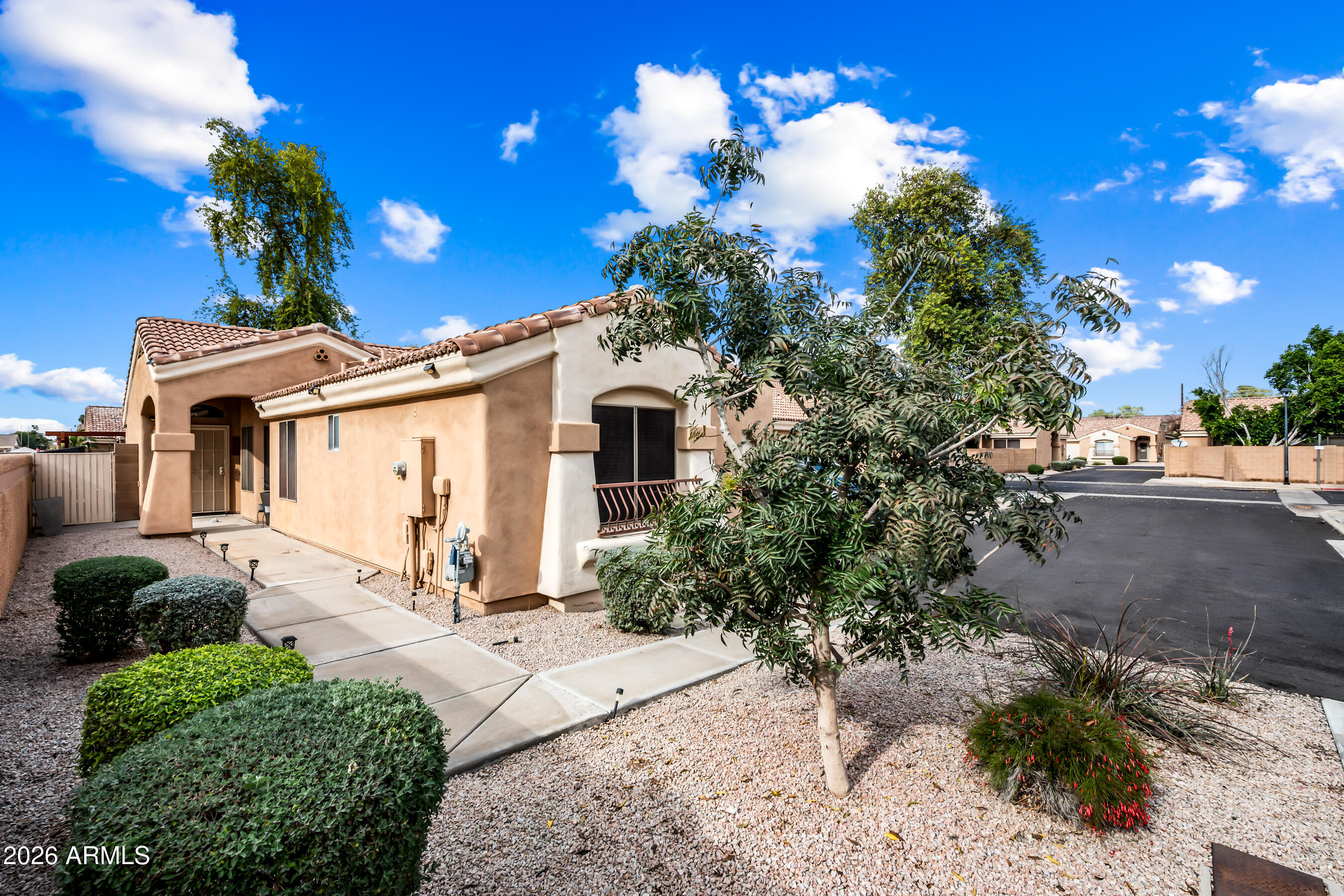1260 South Lindsay Road, Unit 38 Mesa, AZ 85204 - Photo 2 of 23 a view of a house with a yard