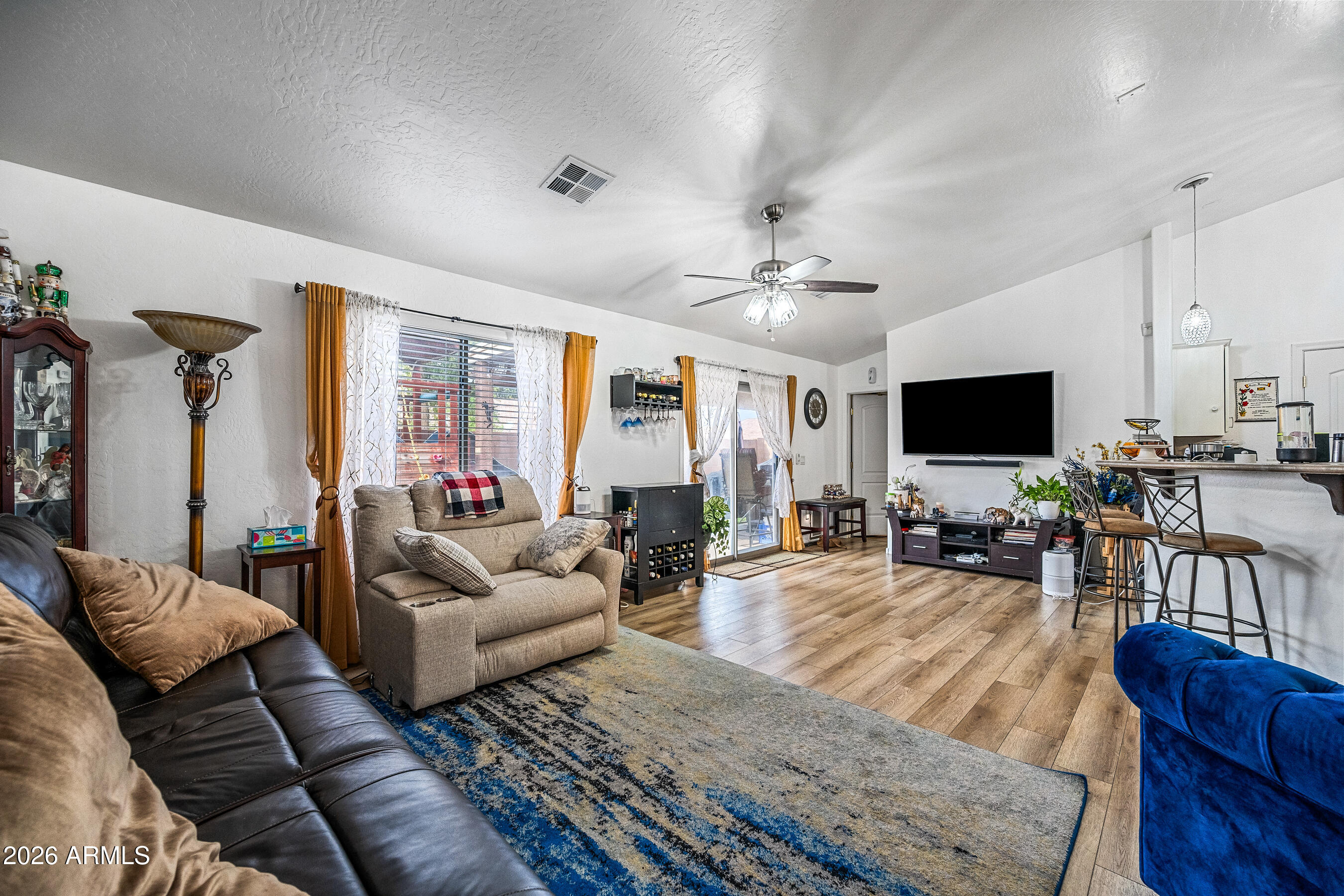 1260 South Lindsay Road, Unit 38 Mesa, AZ 85204 - Photo 22 of 23 a living room with furniture and a flat screen tv