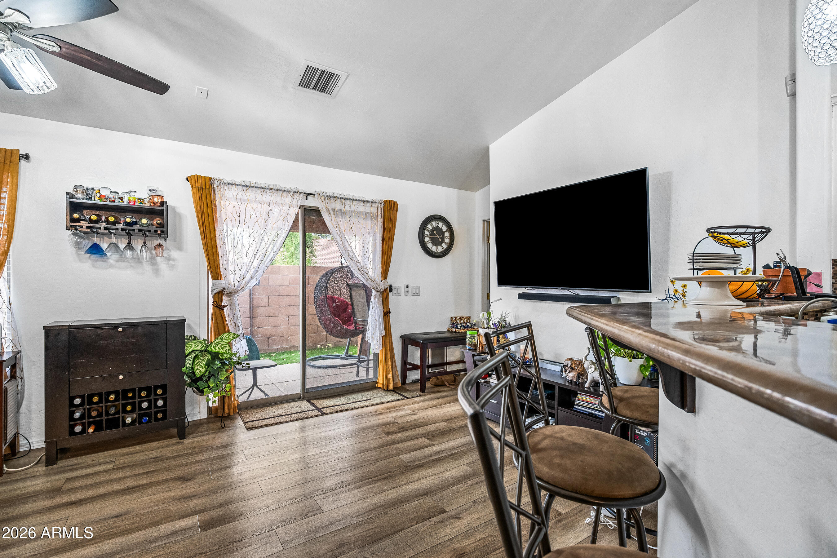 1260 South Lindsay Road, Unit 38 Mesa, AZ 85204 - Photo 6 of 23 a living room with furniture and a flat screen tv