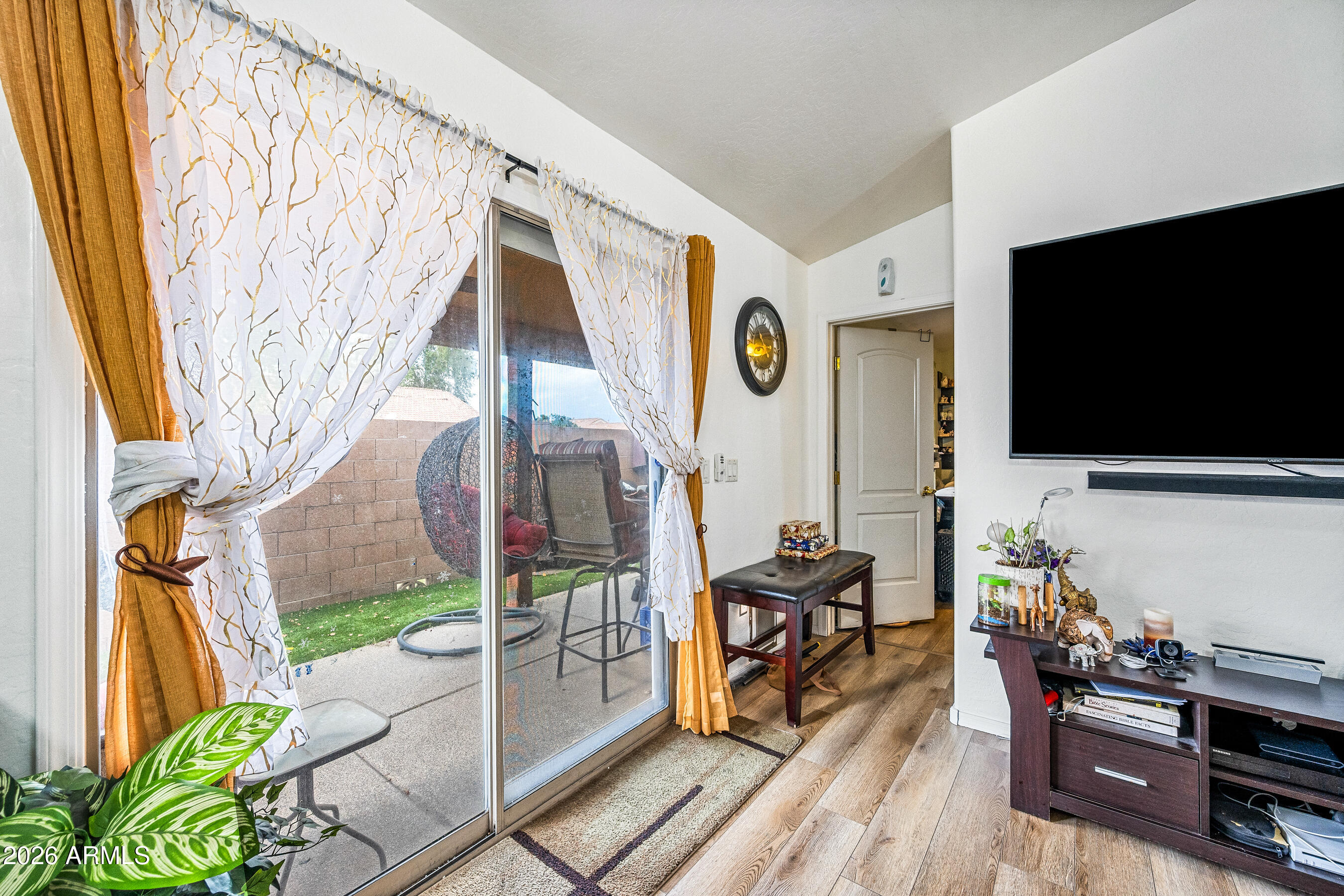 1260 South Lindsay Road, Unit 38 Mesa, AZ 85204 - Photo 9 of 23 a living room with furniture and a flat screen tv
