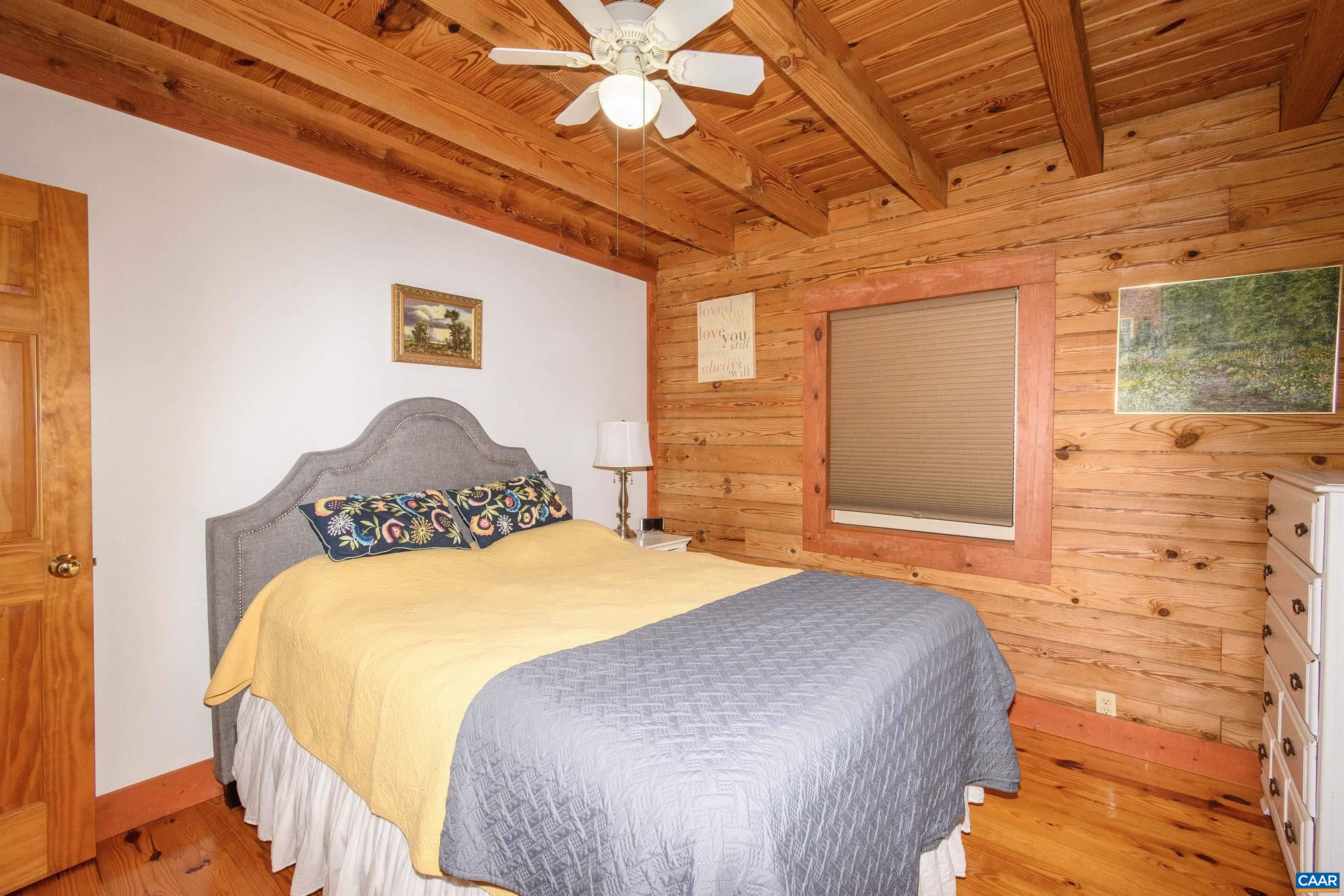 11441 Old Lawyers Road Unionville, VA 22567 - Photo 14 of 45 a bedroom with a bed and a painting on the wall