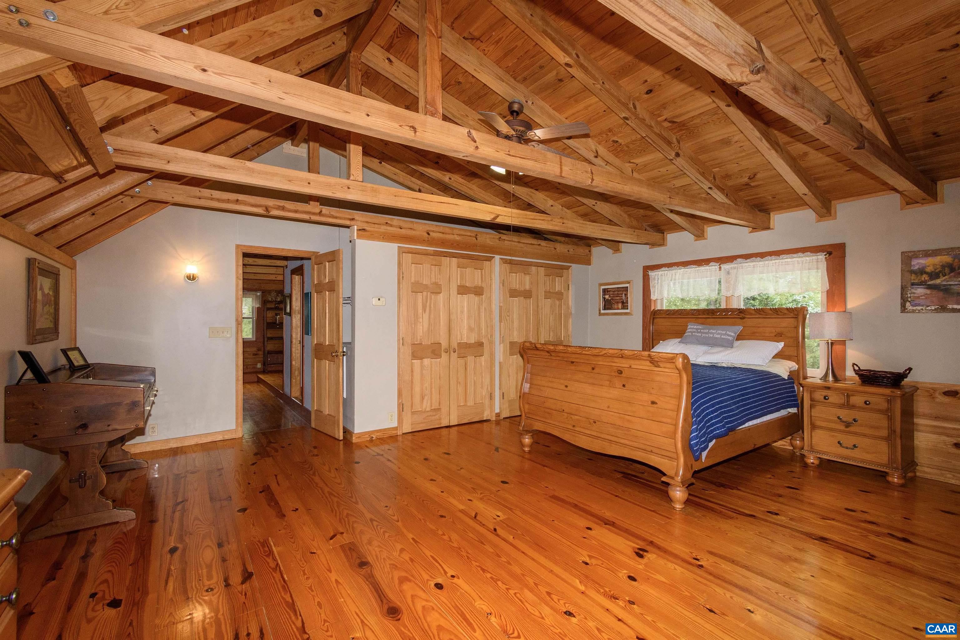 11441 Old Lawyers Road Unionville, VA 22567 - Photo 18 of 45 a bedroom with furniture and wooden floor