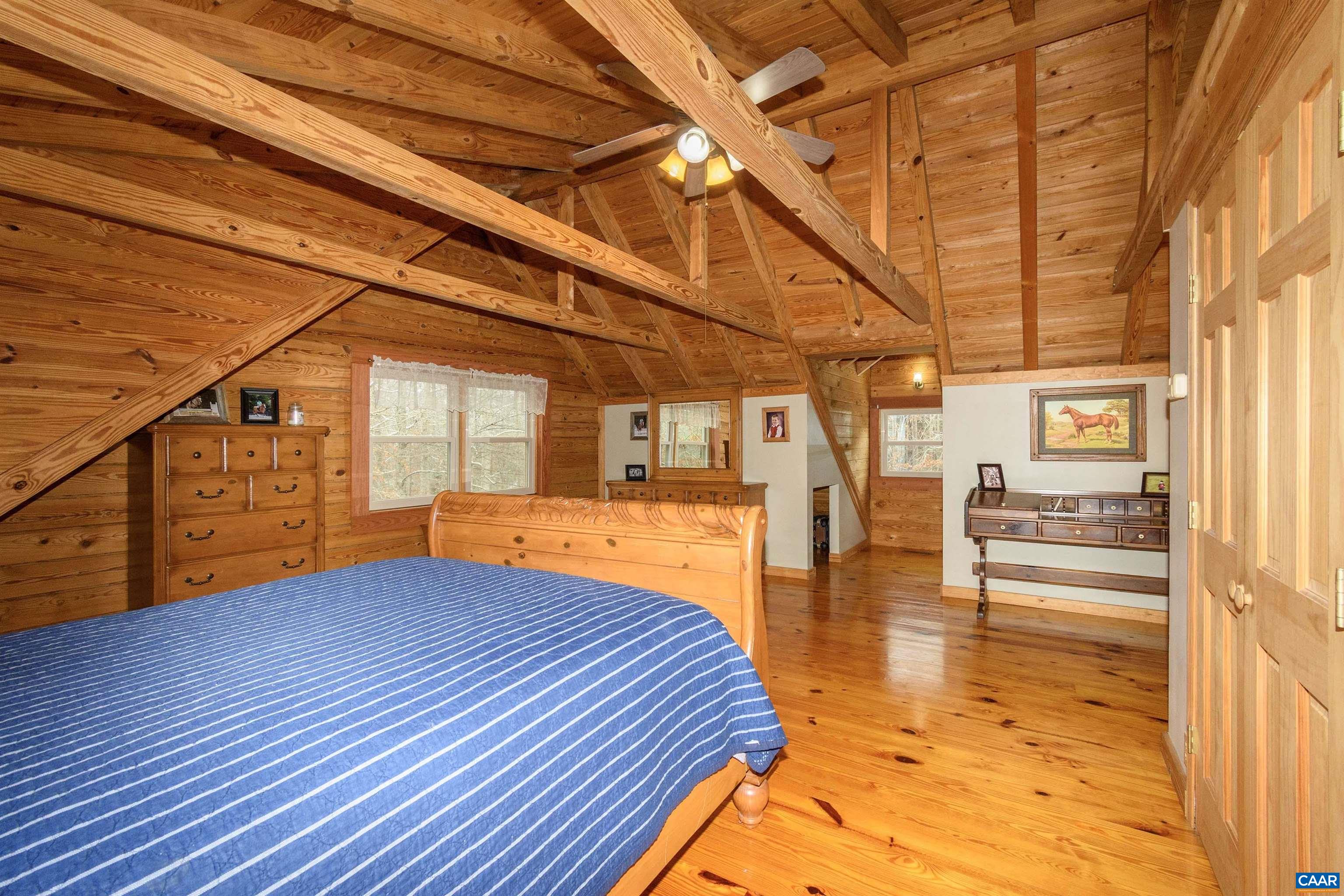 11441 Old Lawyers Road Unionville, VA 22567 - Photo 20 of 45 a bedroom with a bed and wooden floor