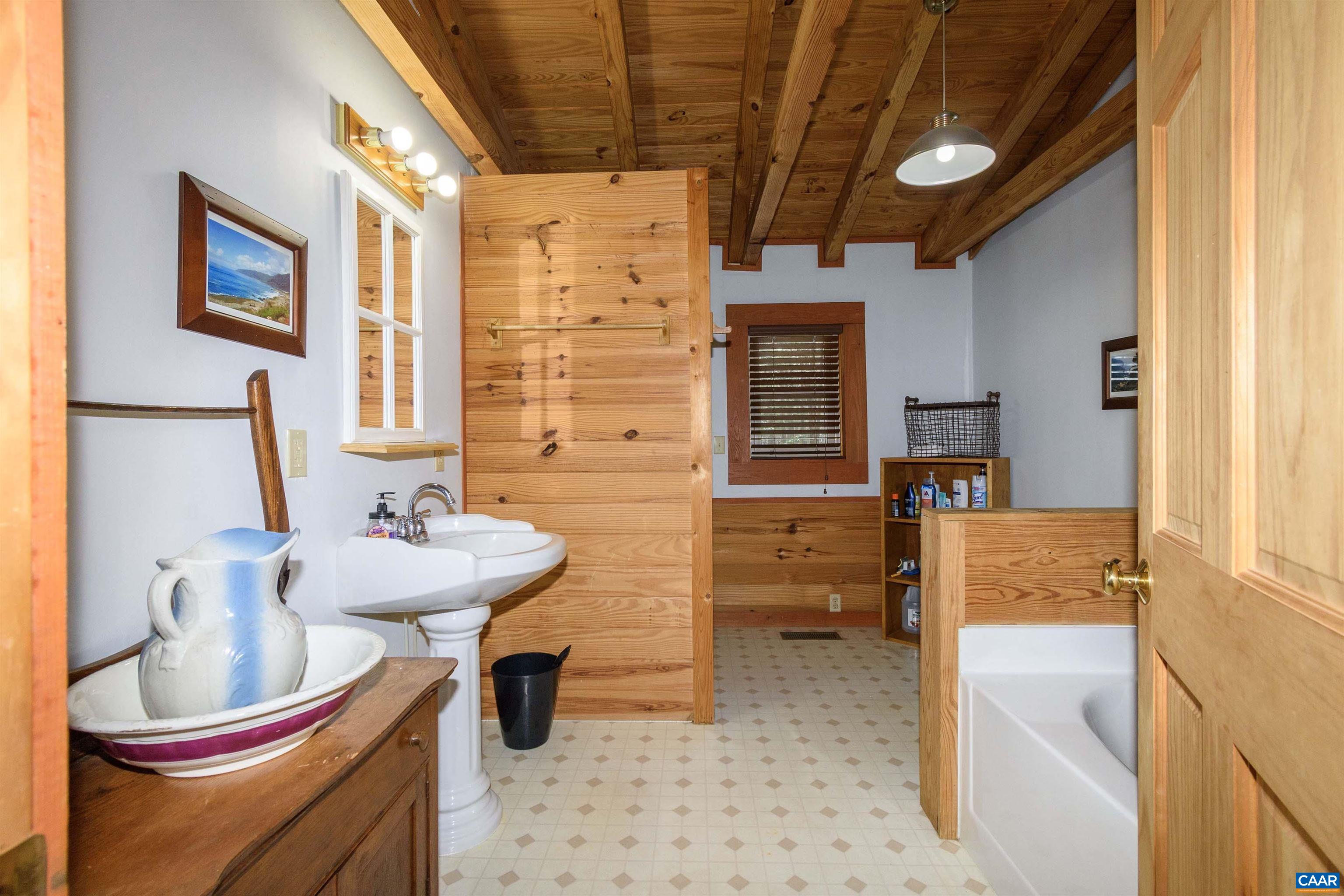 11441 Old Lawyers Road Unionville, VA 22567 - Photo 26 of 45 a bathroom with a sink and a mirror