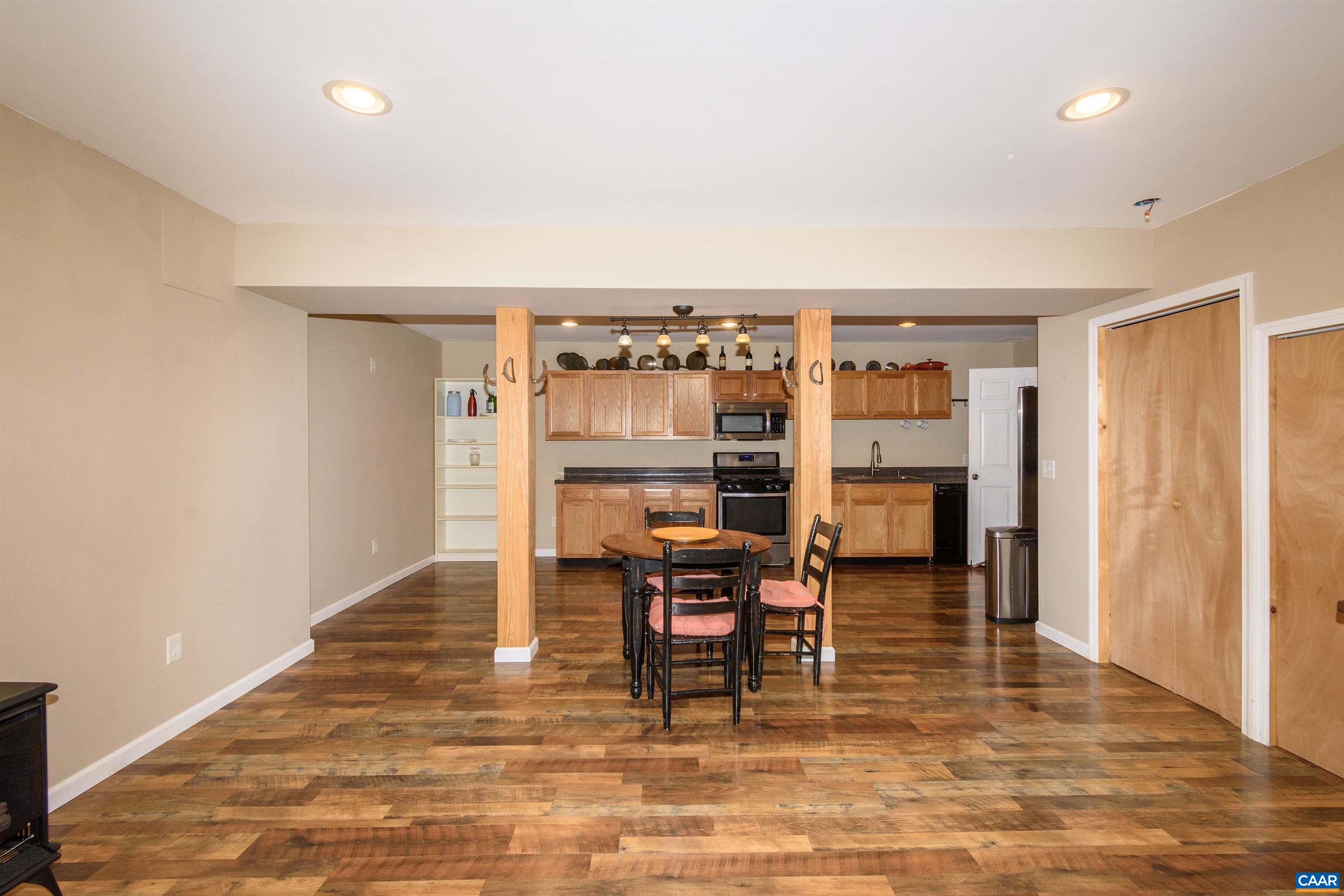 11441 Old Lawyers Road Unionville, VA 22567 - Photo 27 of 45 a dining room with furniture and wooden floor
