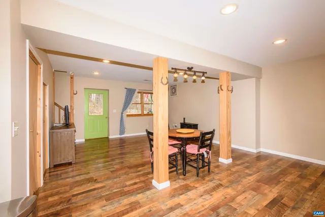 a view of a livingroom with furniture and a flat screen tv