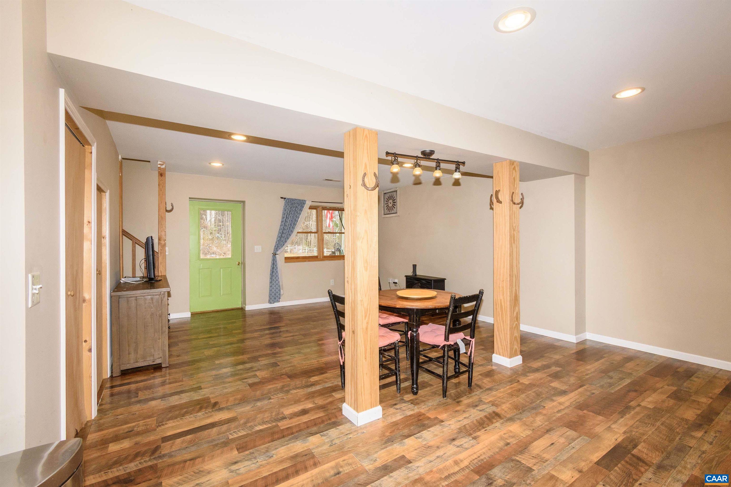 11441 Old Lawyers Road Unionville, VA 22567 - Photo 29 of 45 a view of a room with a wooden table and chairs