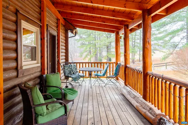 a view of porch with a furniture