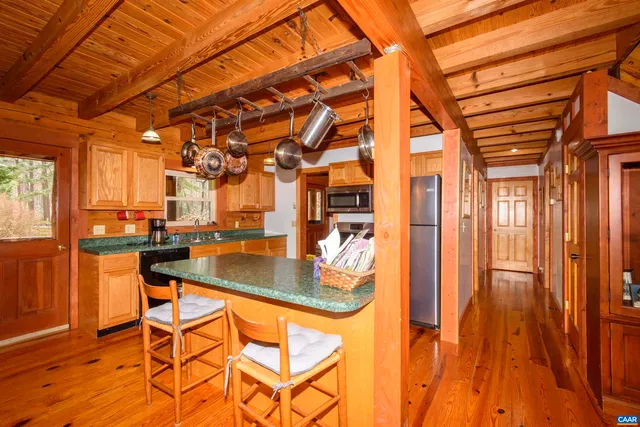 a view of swimming pool with outdoor seating and patio