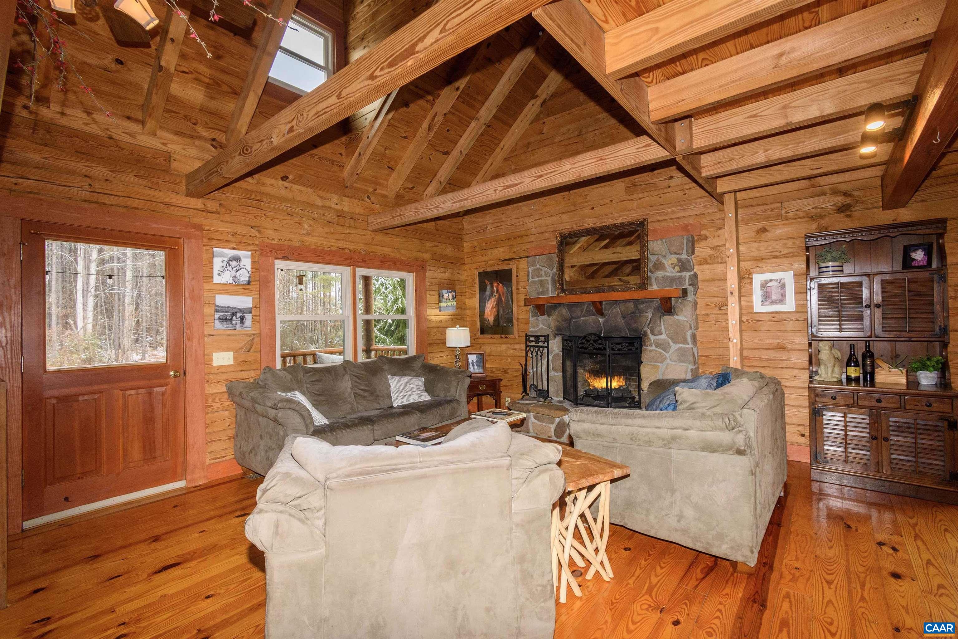 11441 Old Lawyers Road Unionville, VA 22567 - Photo 9 of 45 a living room with furniture and a fireplace
