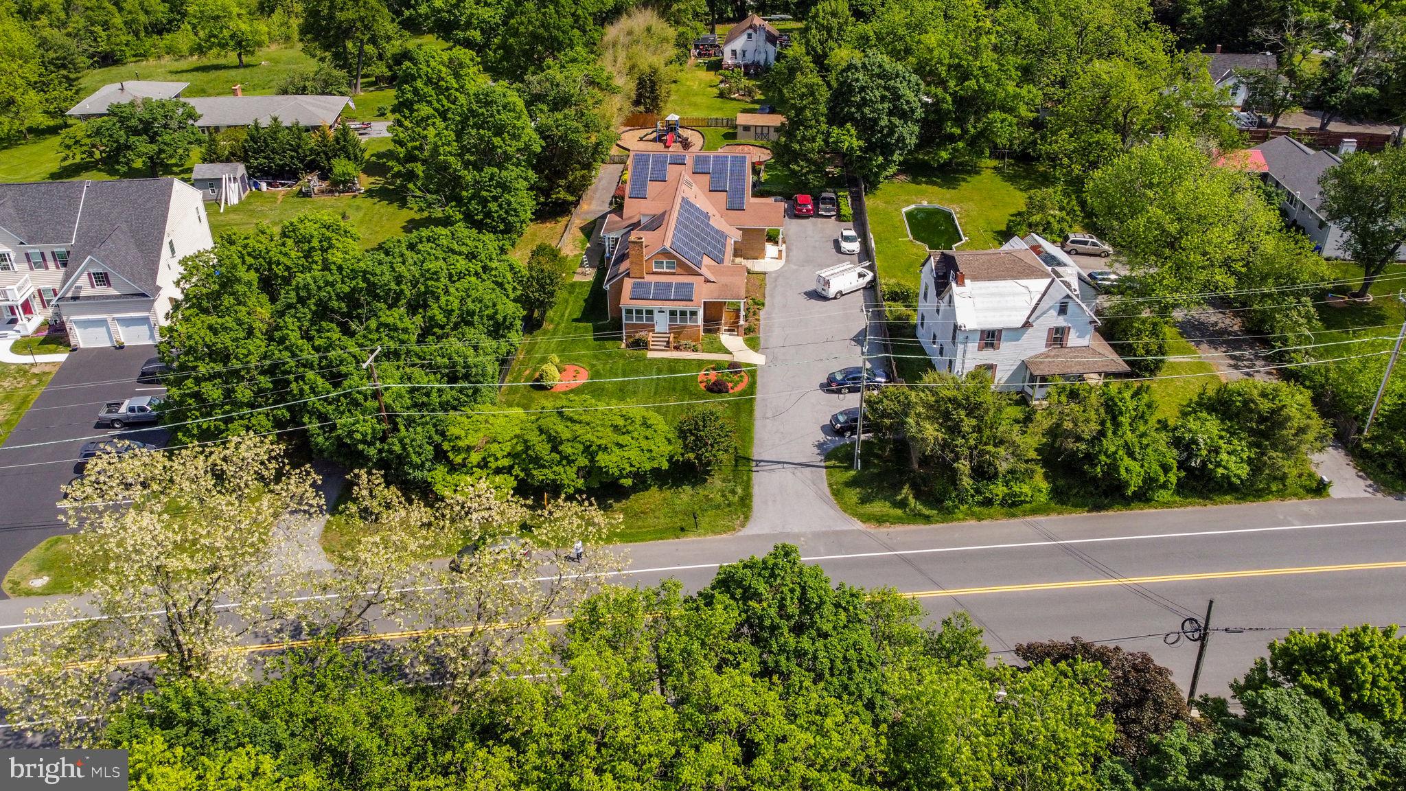 2816 Old Briggs Chaney Road Silver Spring, MD 20905 - Photo 4 of 93 an aerial view of residential house with outdoor space and trees all around
