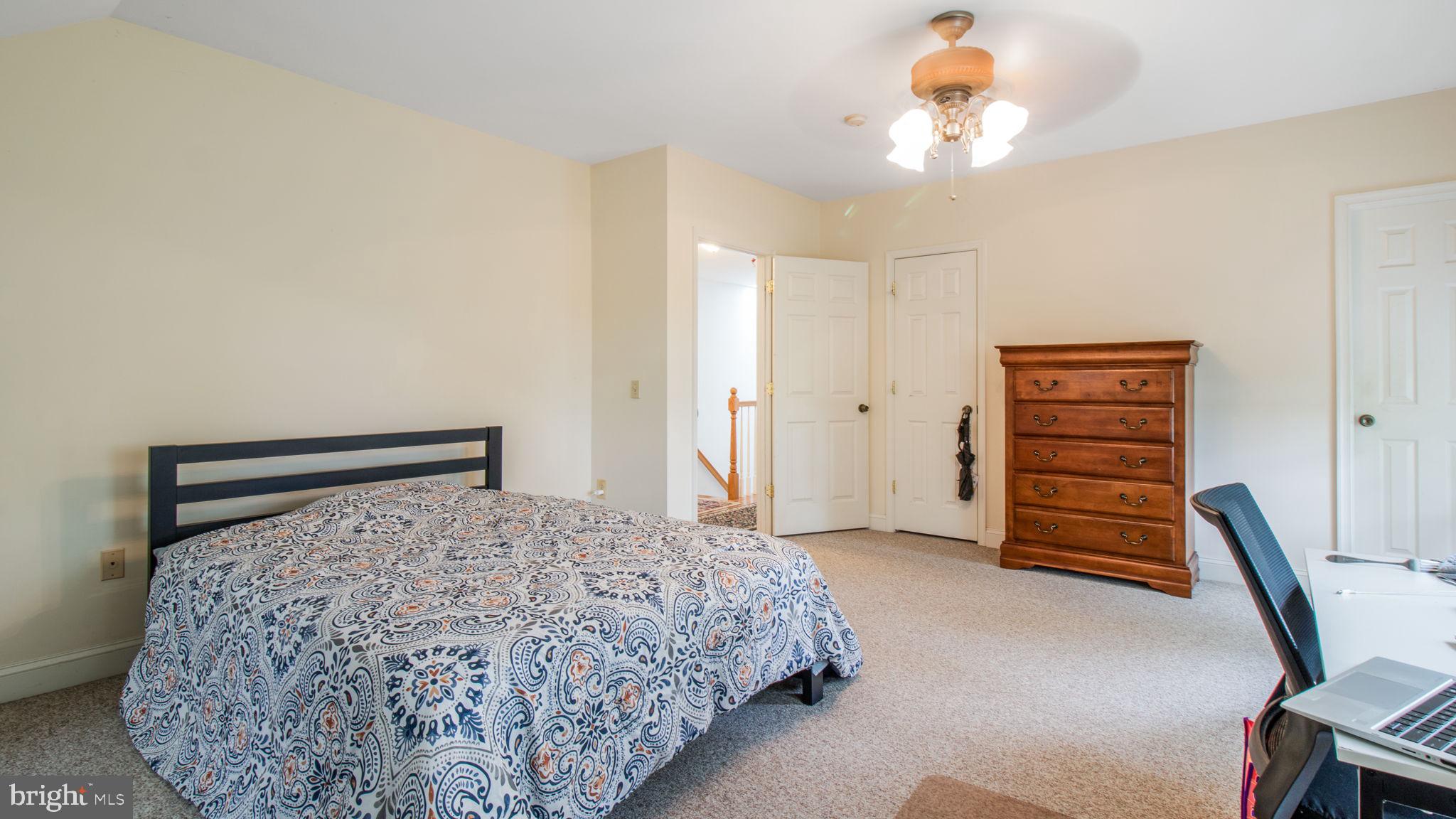 2816 Old Briggs Chaney Road Silver Spring, MD 20905 - Photo 61 of 93 a bedroom with a bed and a dresser