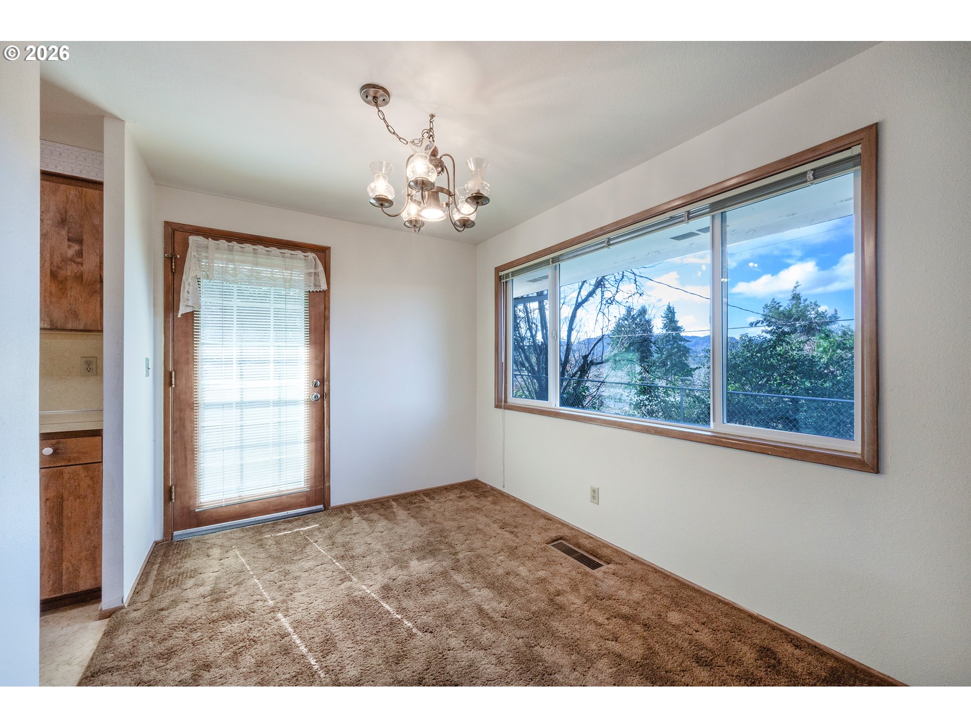 3392 Onyx Place Eugene, OR 97405 - Photo 12 of 41 a view of an empty room with a window