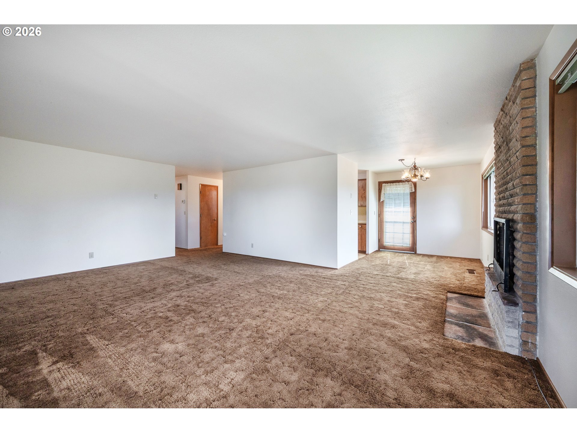 3392 Onyx Place Eugene, OR 97405 - Photo 15 of 41 a view of an empty room and fire place