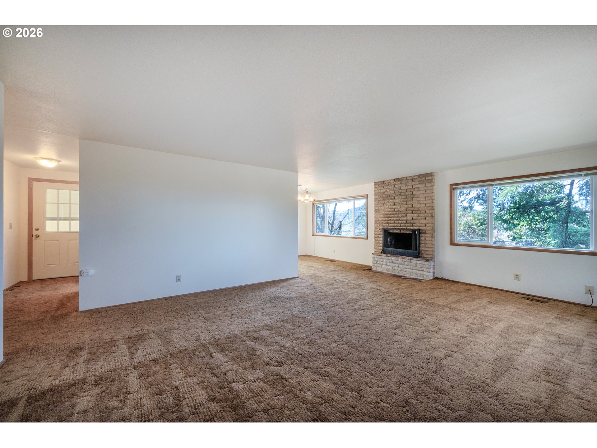 3392 Onyx Place Eugene, OR 97405 - Photo 17 of 41 a view of an empty room with a fireplace