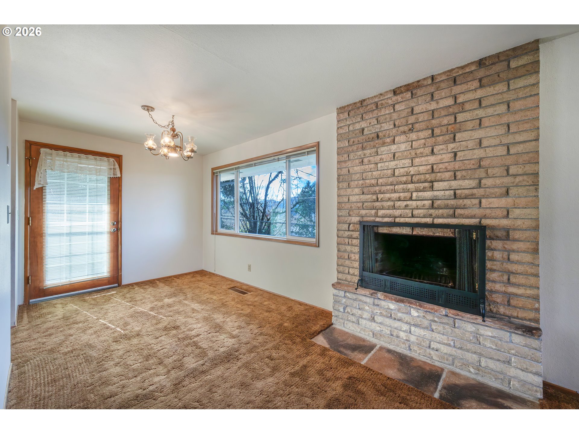 3392 Onyx Place Eugene, OR 97405 - Photo 21 of 41 a view of an empty room with a fireplace