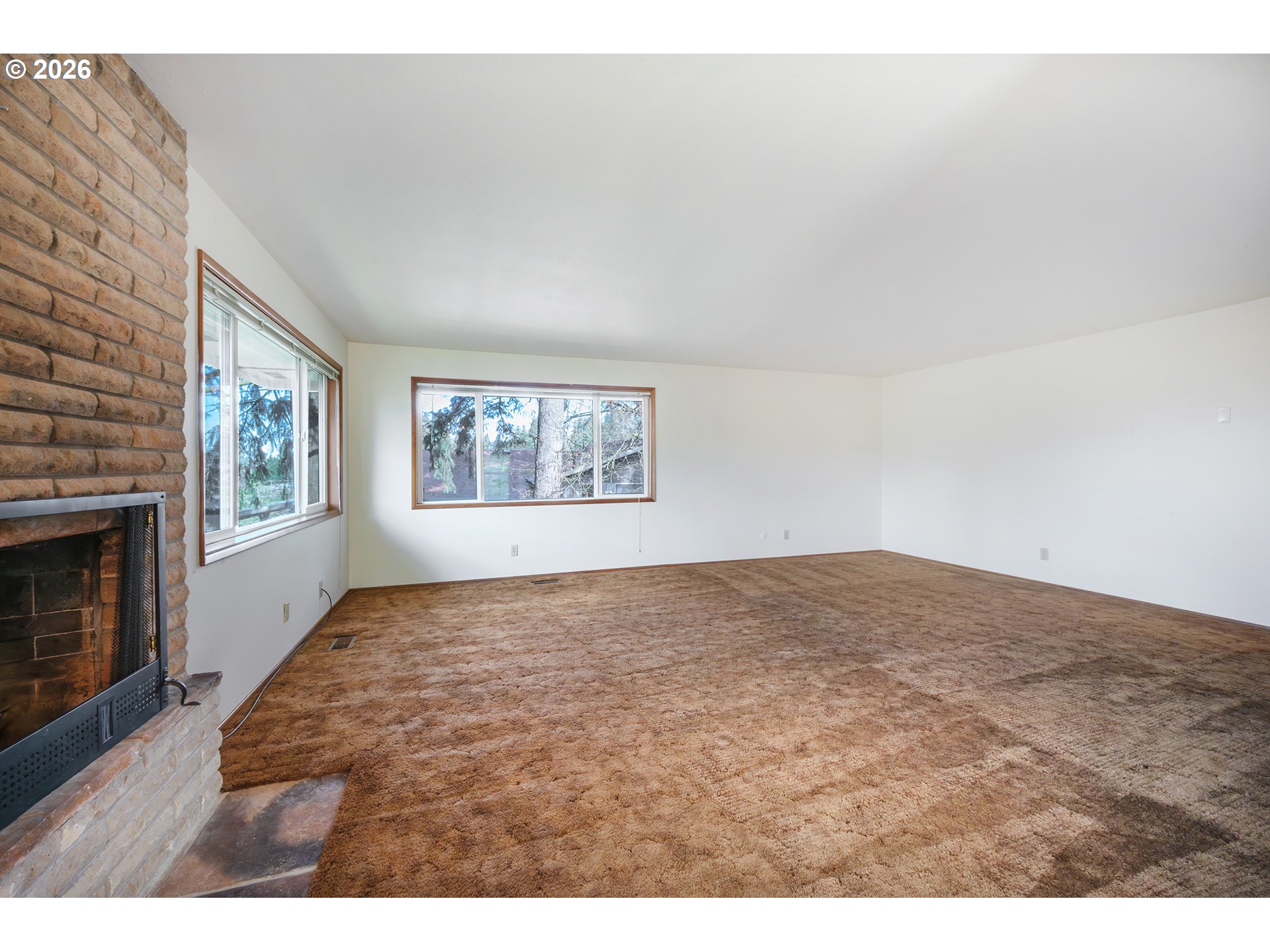 3392 Onyx Place Eugene, OR 97405 - Photo 23 of 41 a view of empty room with window and fireplace