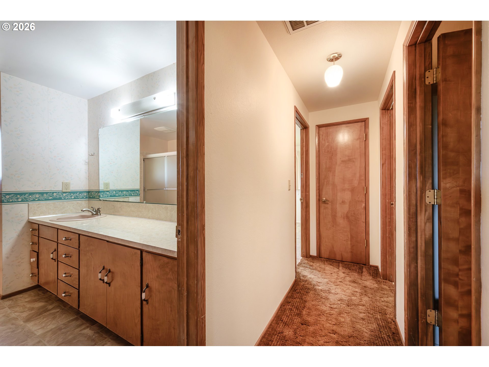 3392 Onyx Place Eugene, OR 97405 - Photo 24 of 41 a bathroom with a double vanity sink and mirror