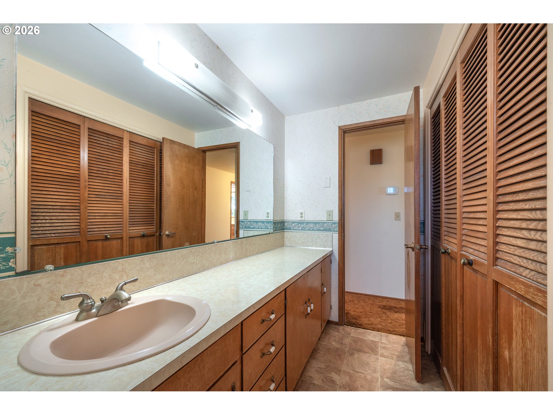 3392 Onyx Place Eugene, OR 97405 - Photo 26 of 41 a bathroom with a sink double vanity granite tub shower and a mirror