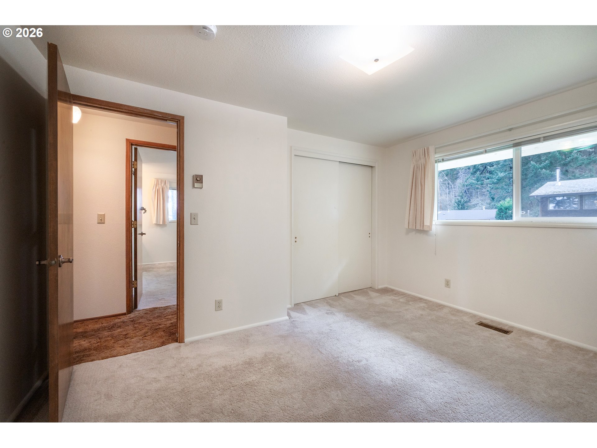 3392 Onyx Place Eugene, OR 97405 - Photo 32 of 41 a view of an empty room with windows
