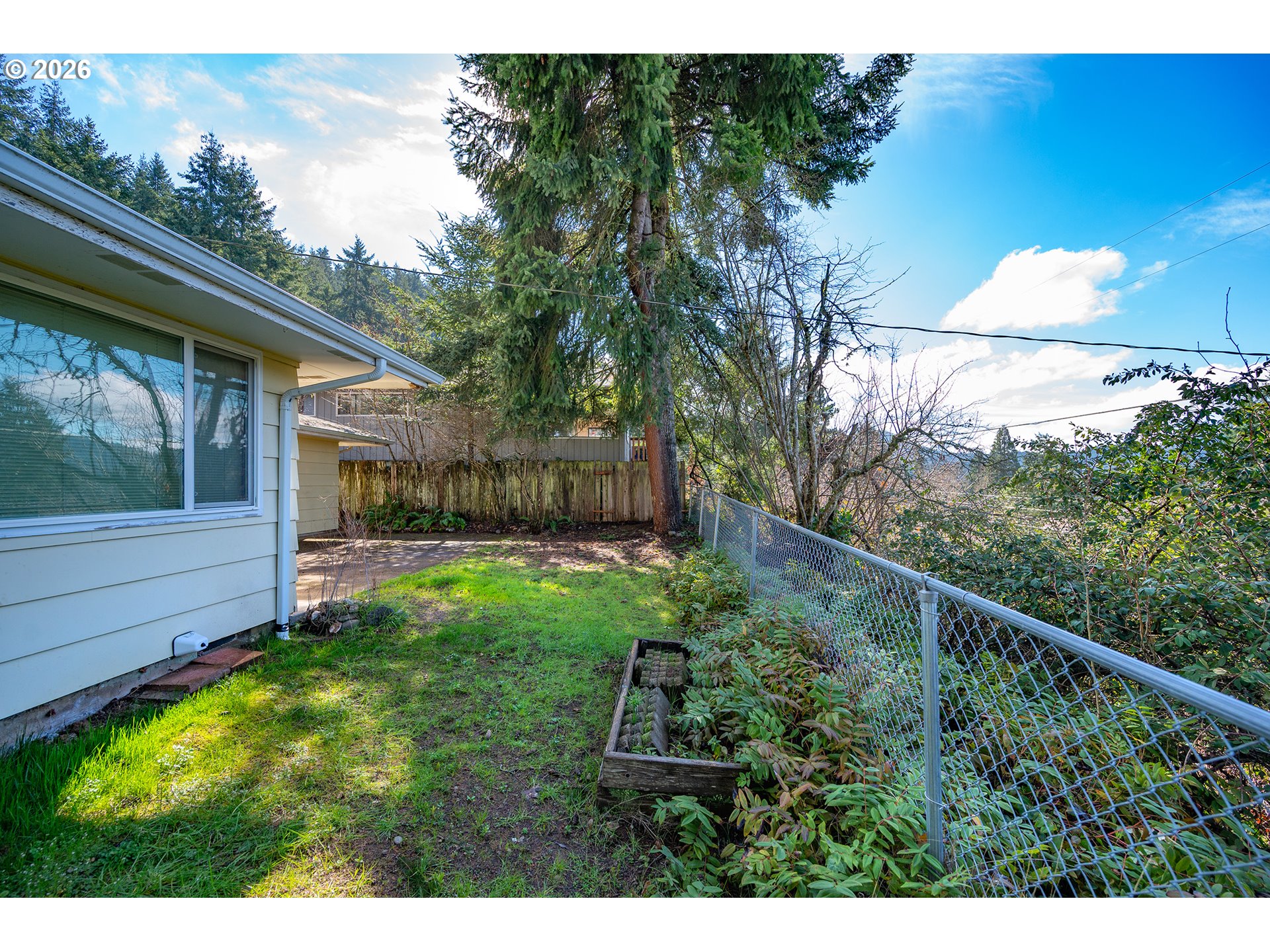 3392 Onyx Place Eugene, OR 97405 - Photo 40 of 41 a view of backyard with a garden and deck