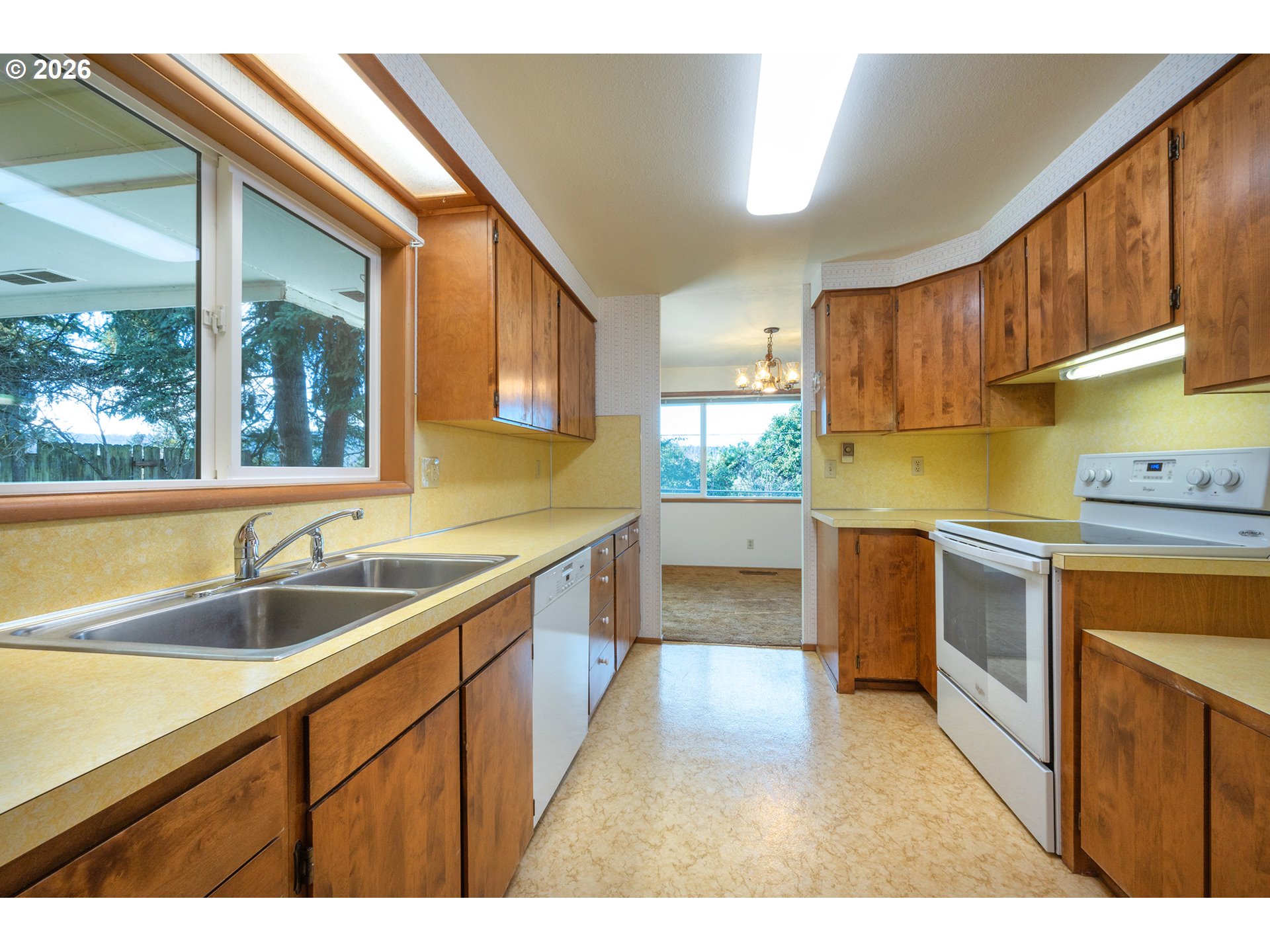 3392 Onyx Place Eugene, OR 97405 - Photo 7 of 41 a kitchen with a sink stove and cabinets