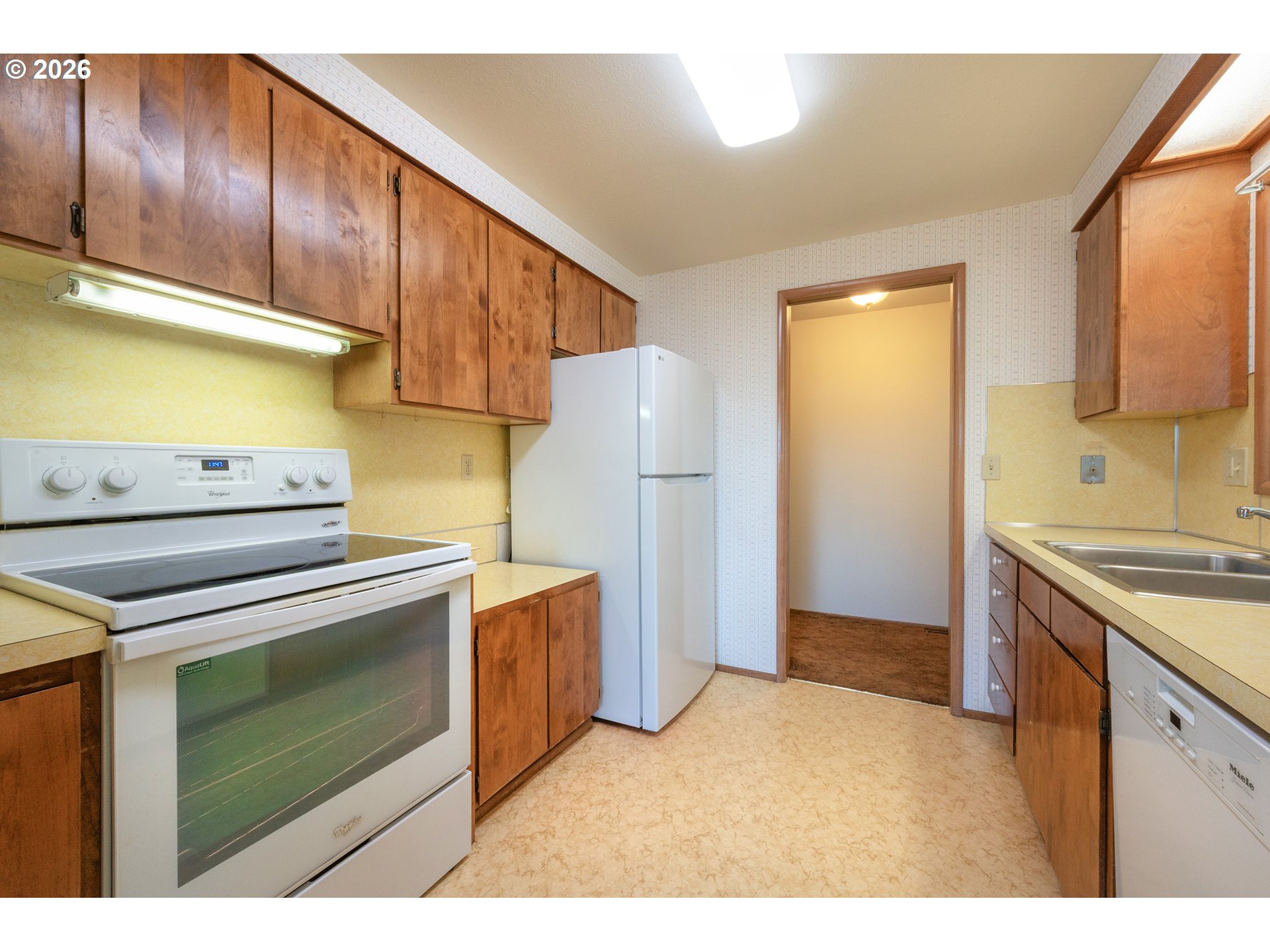 3392 Onyx Place Eugene, OR 97405 - Photo 10 of 41 a kitchen with a stove cabinets and a refrigerator